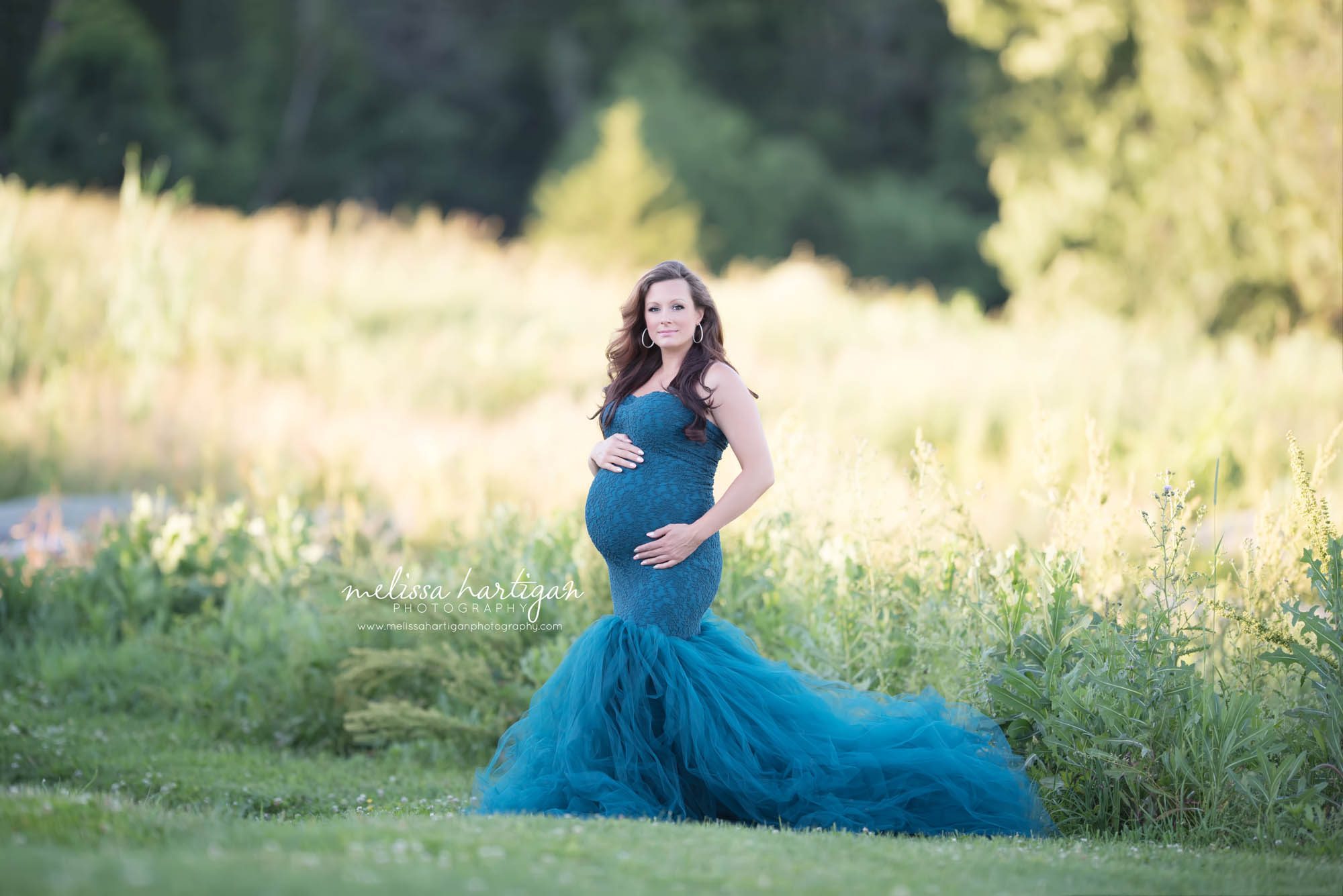 Melissa Hartigan Photography Connecticut Best Maternity Photographer in CT Coventry Ct Middlefield CT baby Fairfield county Newborn and maternity CT photographer Maternity photographer Mommy-to-be outdoor session wearing blue lace and tulle dress in field holding belly