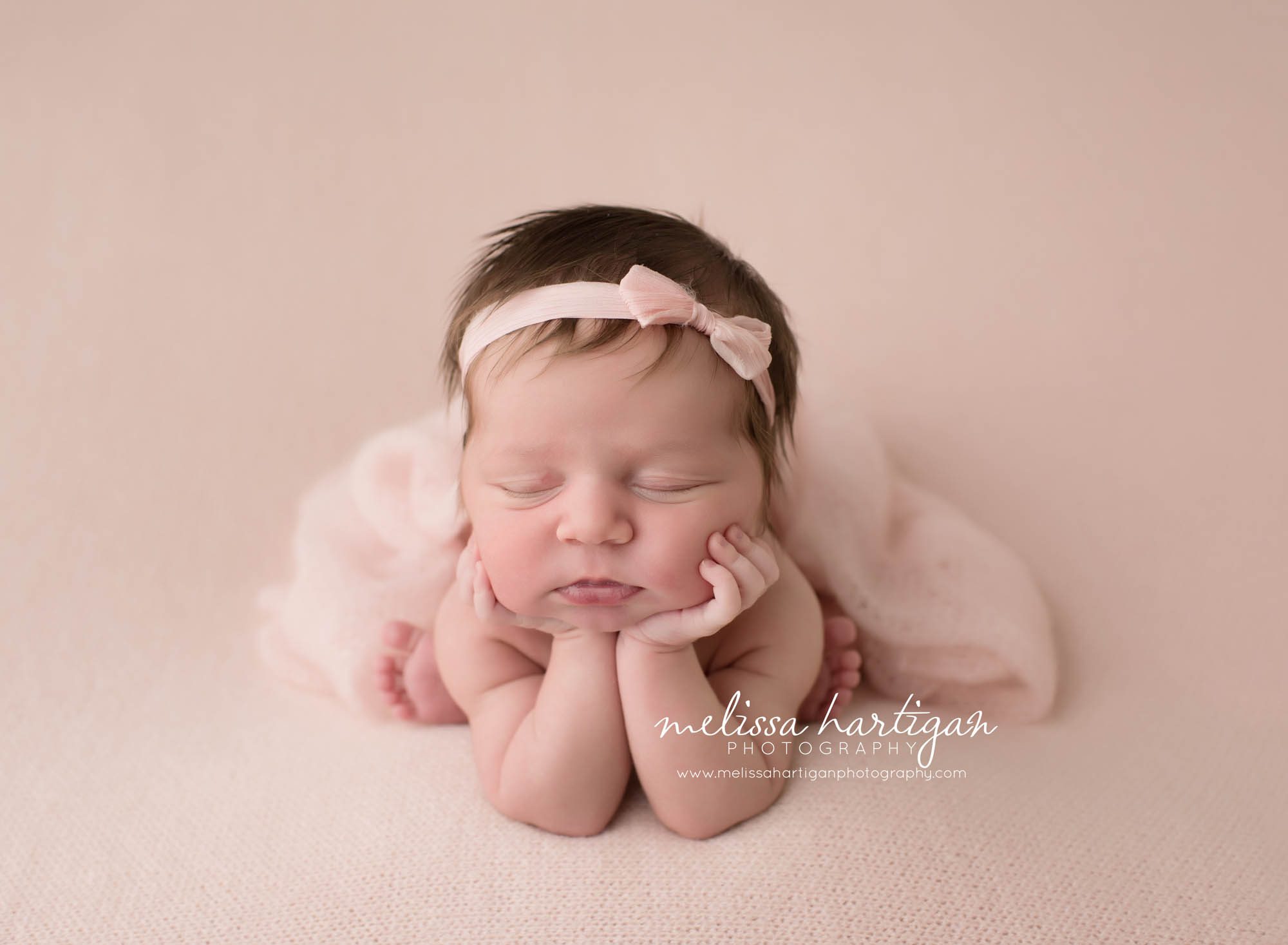 Melissa Hartigan Photography Connecticut Newborn Photographer Coventry Ct Middlefield CT baby Fairfield county Newborn and maternity CT photographer Baby girl pink headband in froggy pose on pink blanket