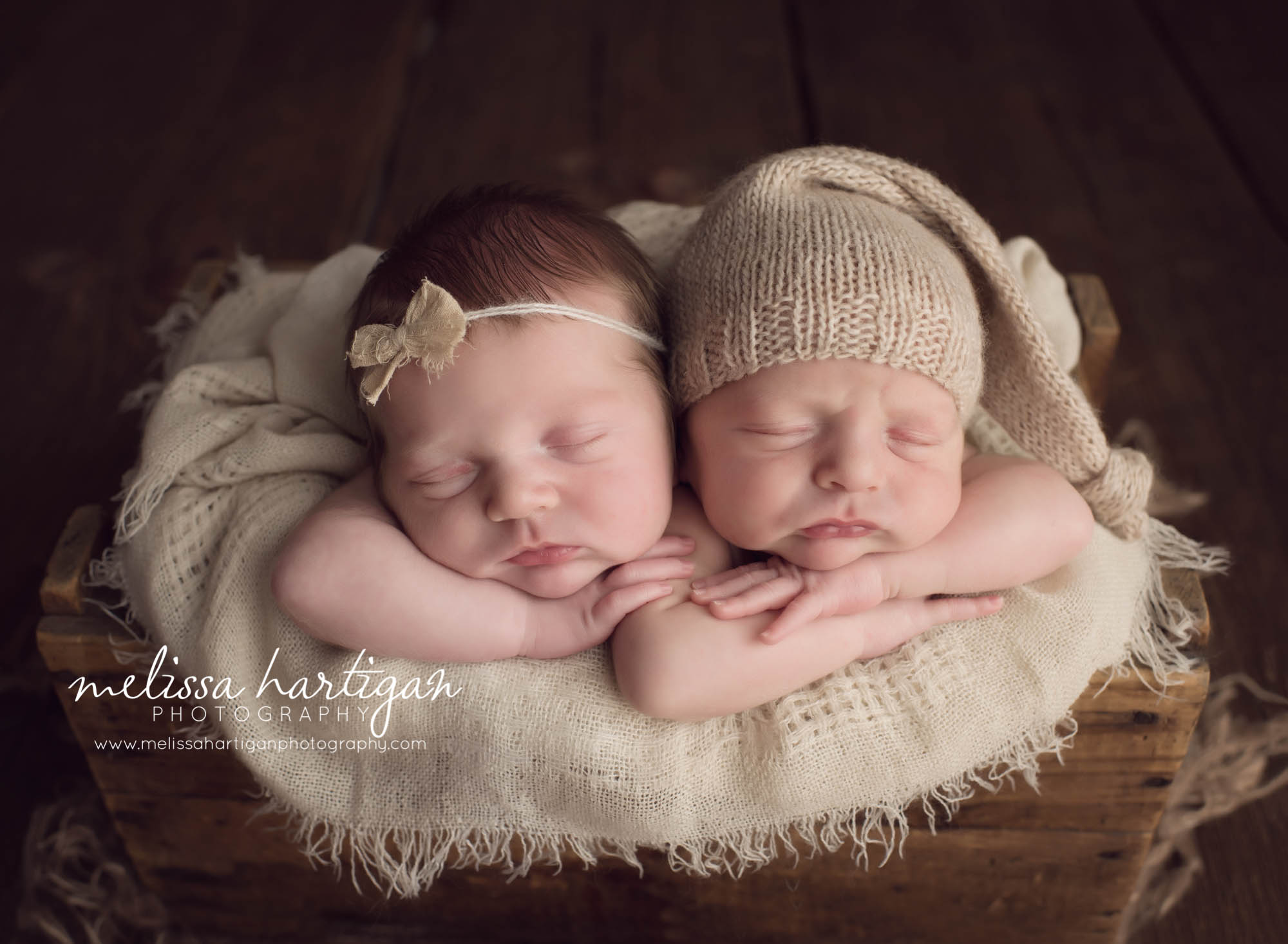 Melissa Hartigan Photography Connecticut Newborn twin Photographer Coventry Ct Middlefield CT baby Fairfield county Newborn and maternity CT photographer Newborn twin photographer baby twins sleeping in wooden box with cream blanket wearing headband and knit hat
