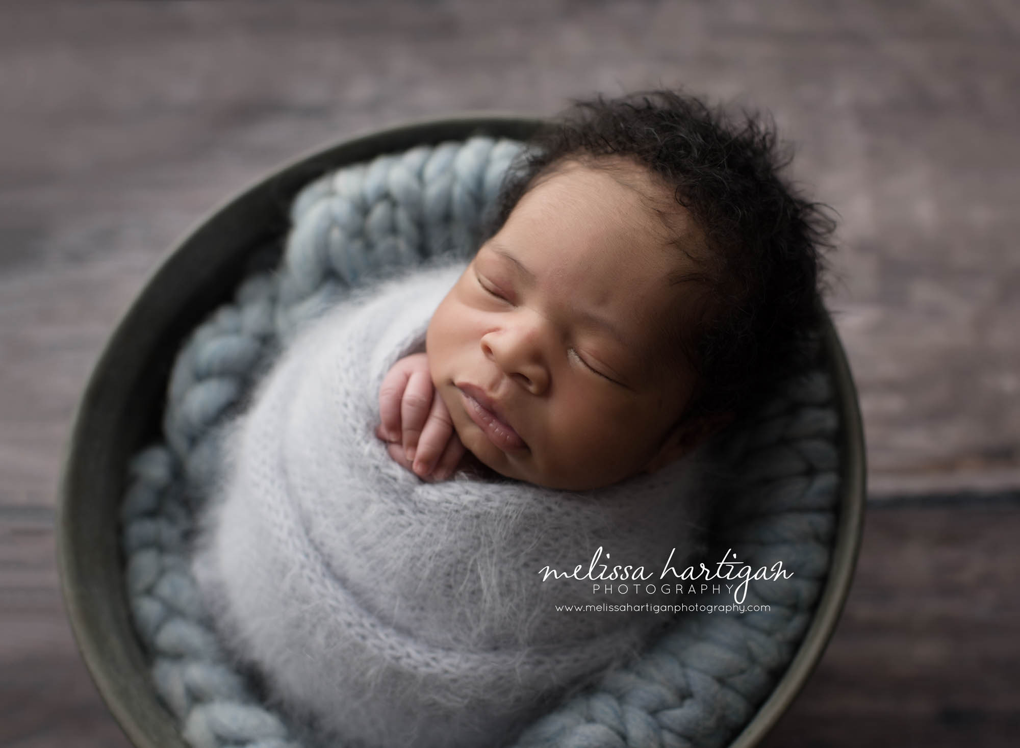 Melissa Hartigan Photography Connecticut Maternity and Newborn CT Photographer Coventry Ct Middlefield CT baby Fairfield county Newborn pose baby boy in metal bucket with blue knit blanket wrapped in blue with hands sticking out sleeping