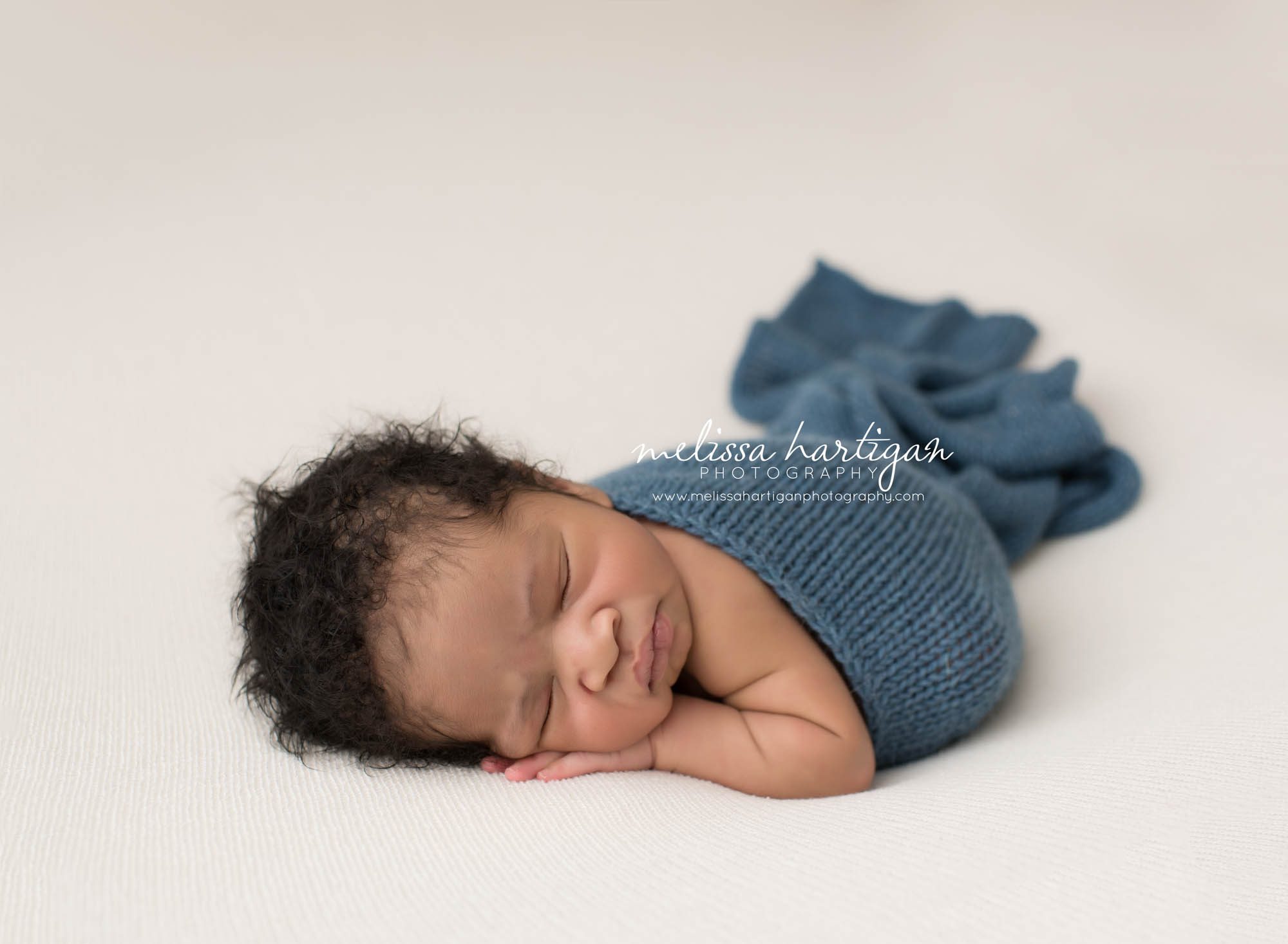 Melissa Hartigan Photography Connecticut Maternity and Newborn CT Photographer Coventry Ct Middlefield CT baby Fairfield county Newborn pose baby boy sleeping on ivory blanket with blue knitted wrap