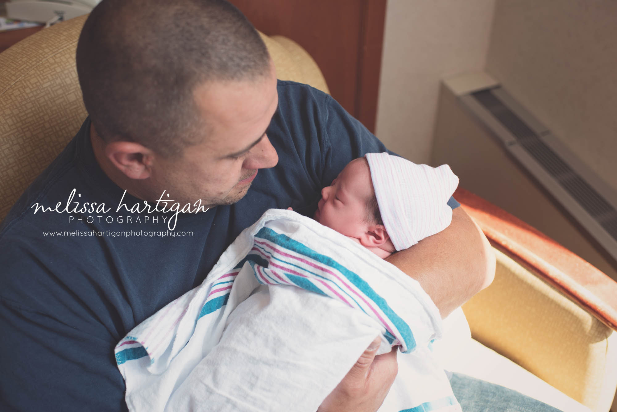 Melissa Hartigan Photography Connecticut Maternity and Newborn Photographer Piper Fresh 48 Newborn Session dad holding baby swaddled in arms