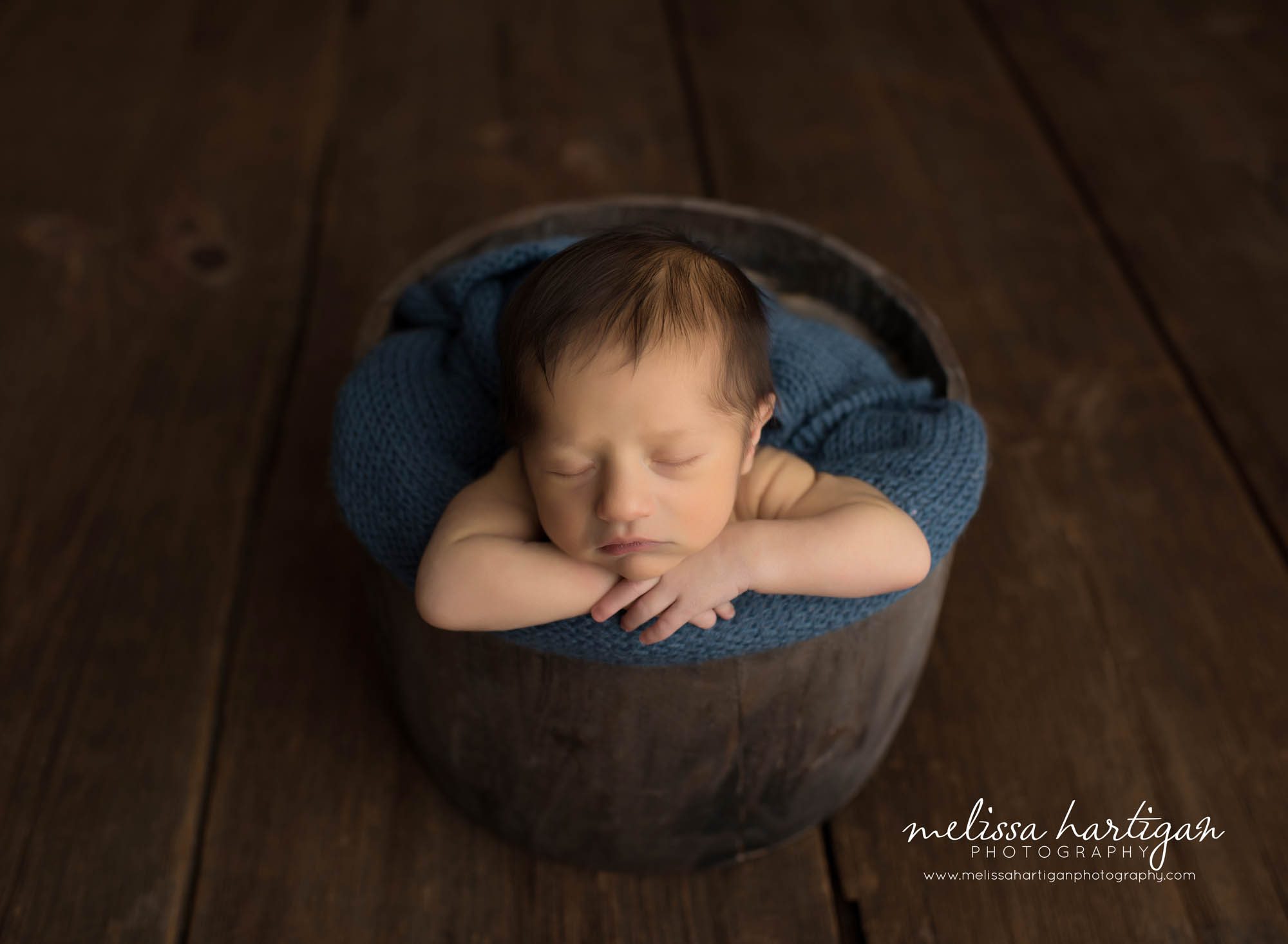 Melissa Hartigan Photography Maternity and Newborn Connecticut Photographer Brayden Mini Newborn Session Baby boy sleeping in wooden bowl with blue knit blanket