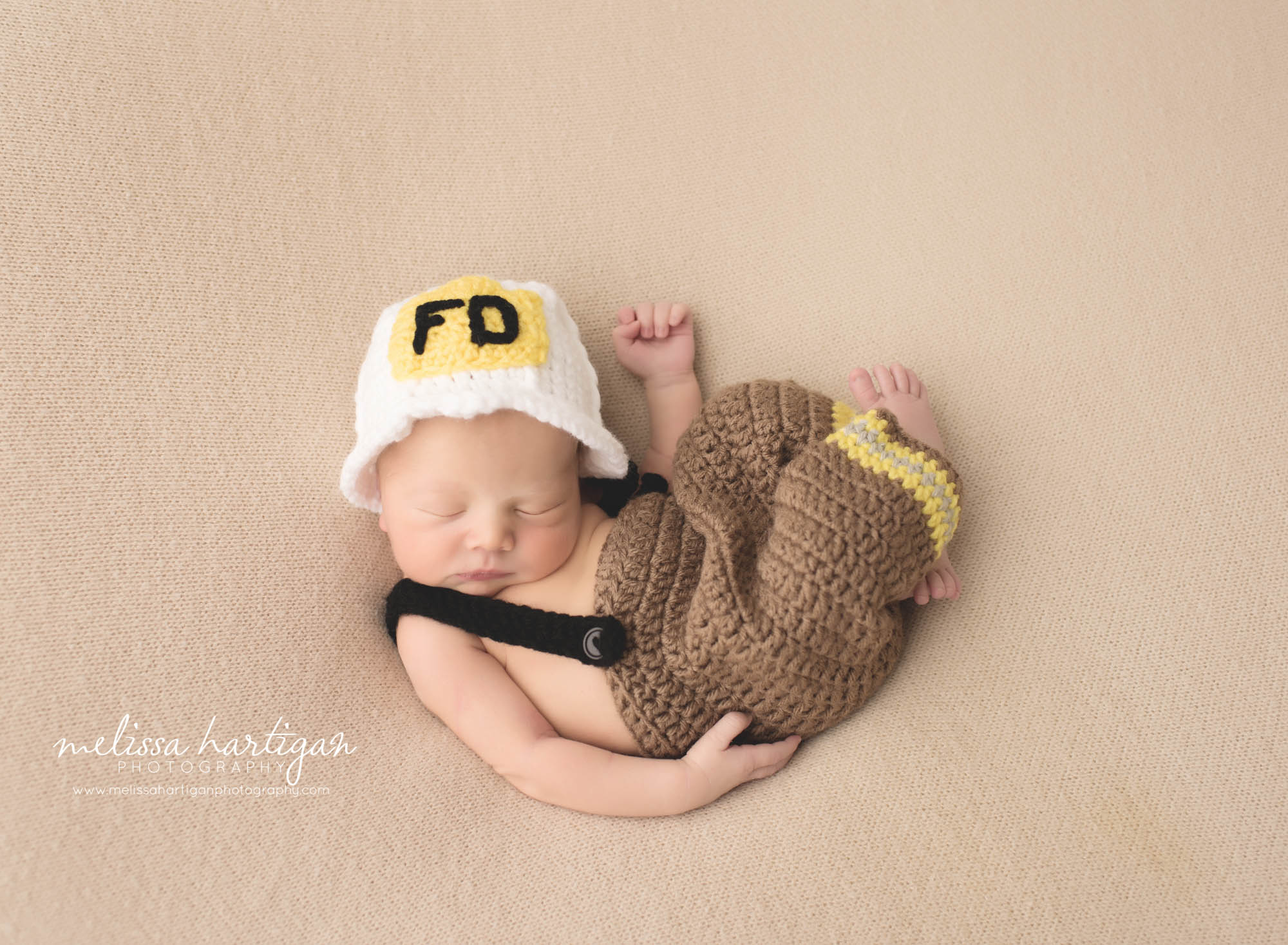 Melissa Hartigan Photography CT Newborn Photographer Braeden Newborn Session baby boy sleeping wearing knit firefighter outfit and hat