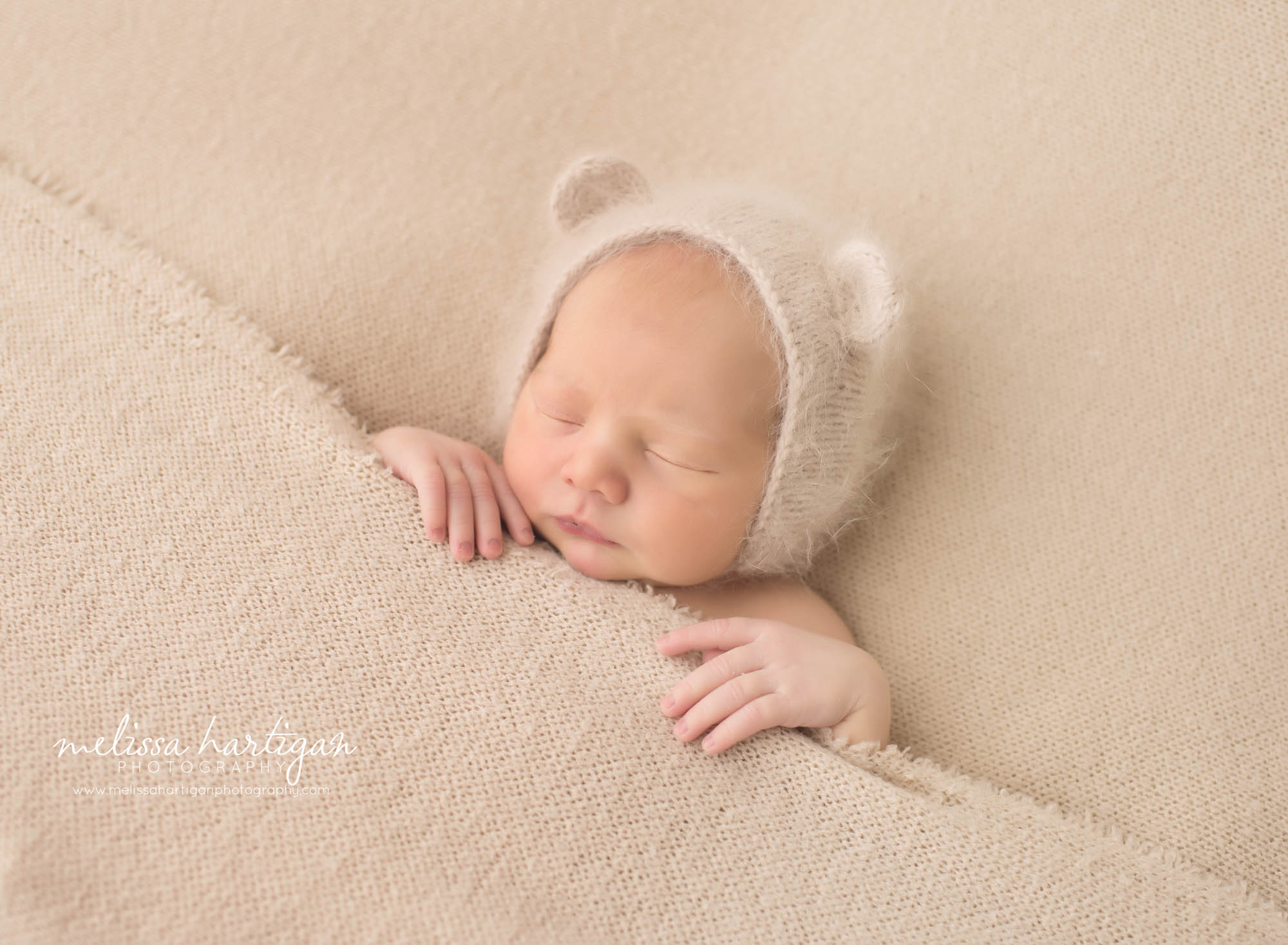 Melissa Hartigan Photography CT Newborn Photographer Braeden Newborn Session baby boy sleeping under tan blanket wearing knit hat with ears