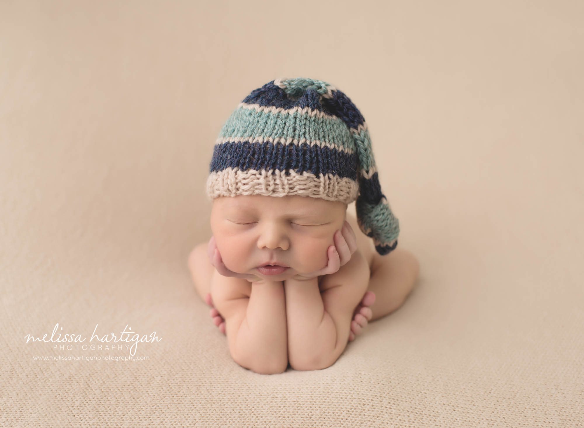 Melissa Hartigan Photography CT Newborn Photographer Braeden Newborn Session baby boy sleeping in froggy pose wearing blue striped knit hat