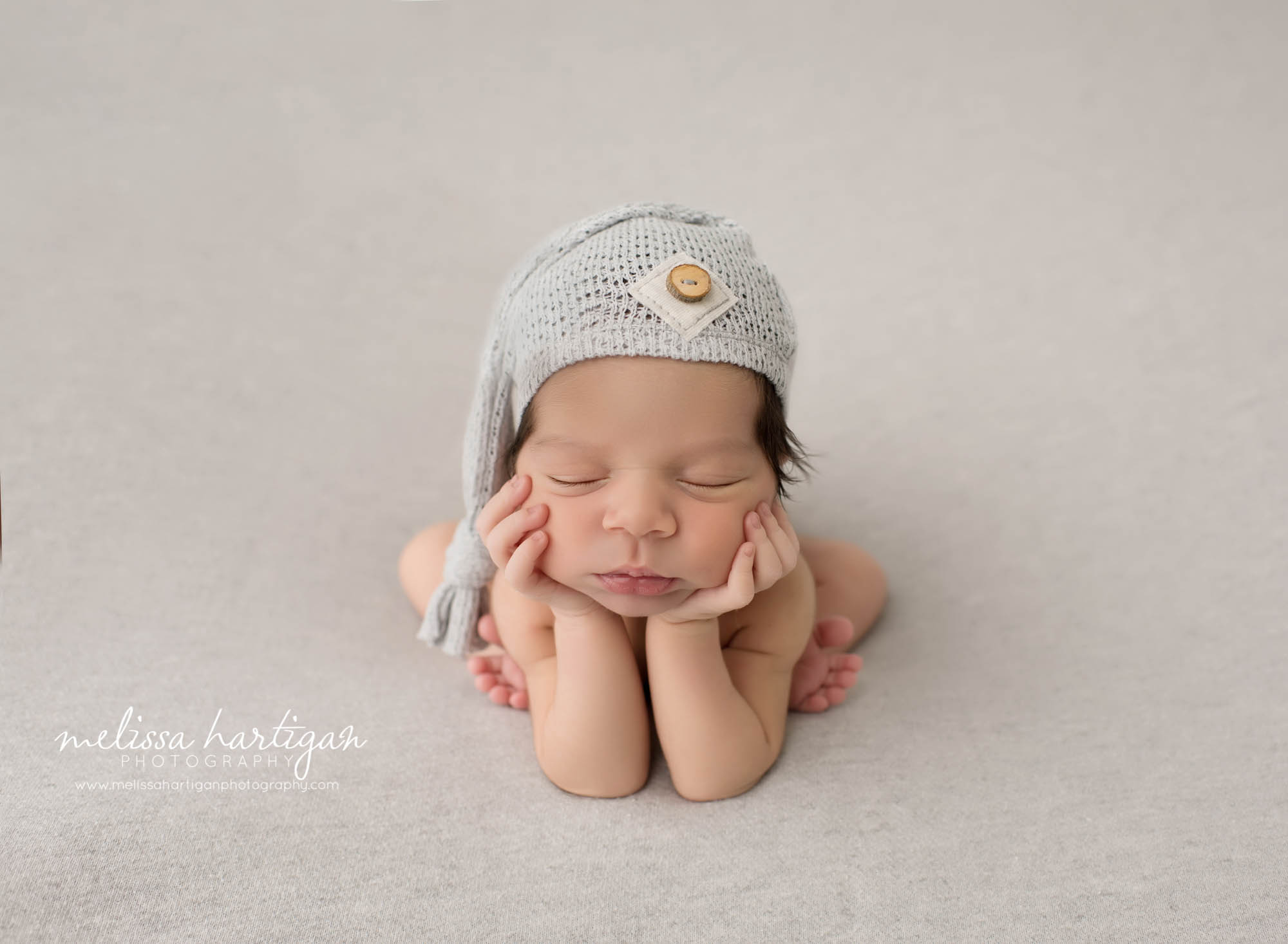 Melissa Hartigan Photography CT Newborn Photographer East Hartford baby boy sleeping in froggy pose wearing light blue knit hat