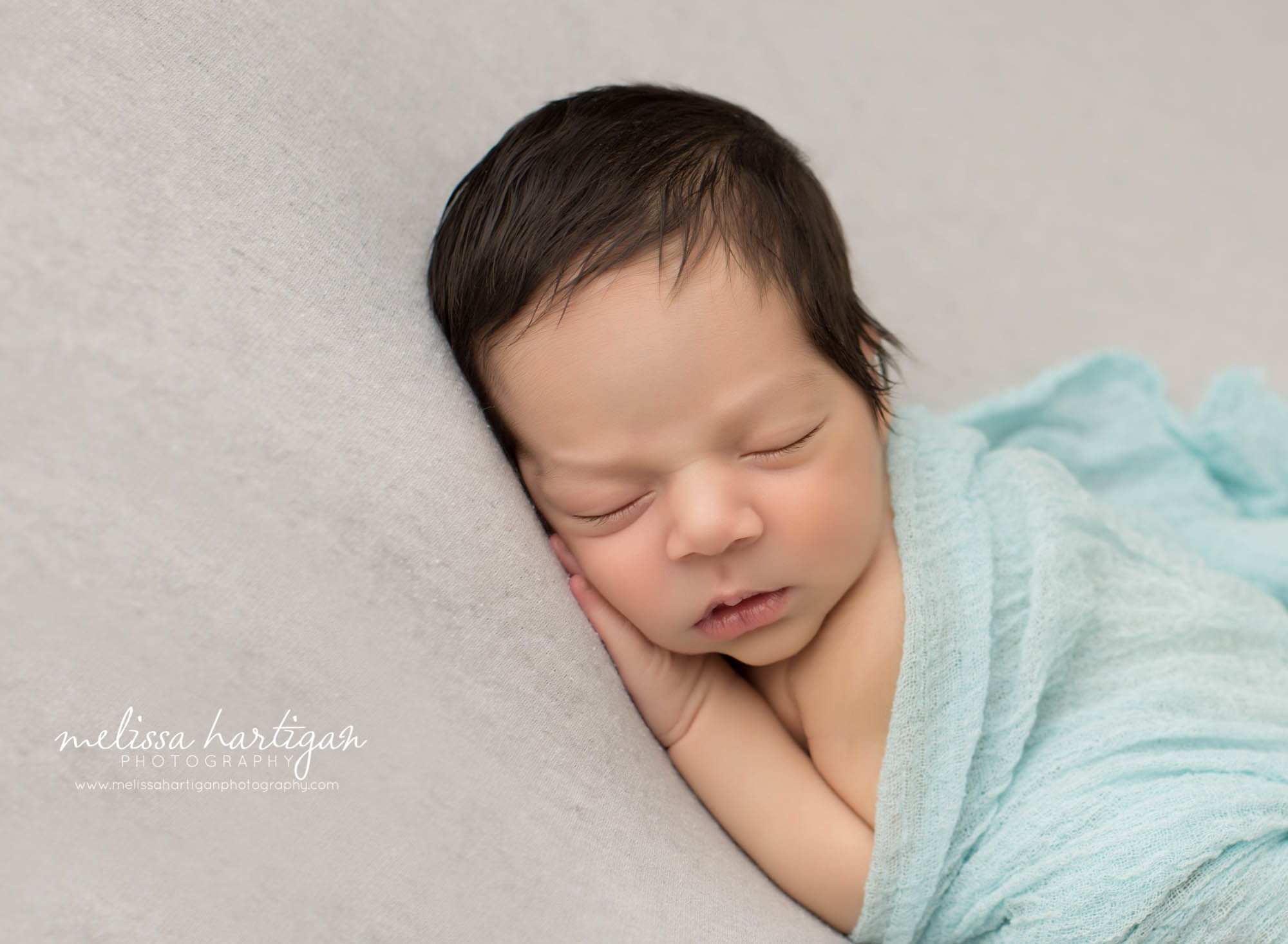 Melissa Hartigan Photography CT Newborn Photographer East Hartford baby boy sleeping covered with light blue wrap