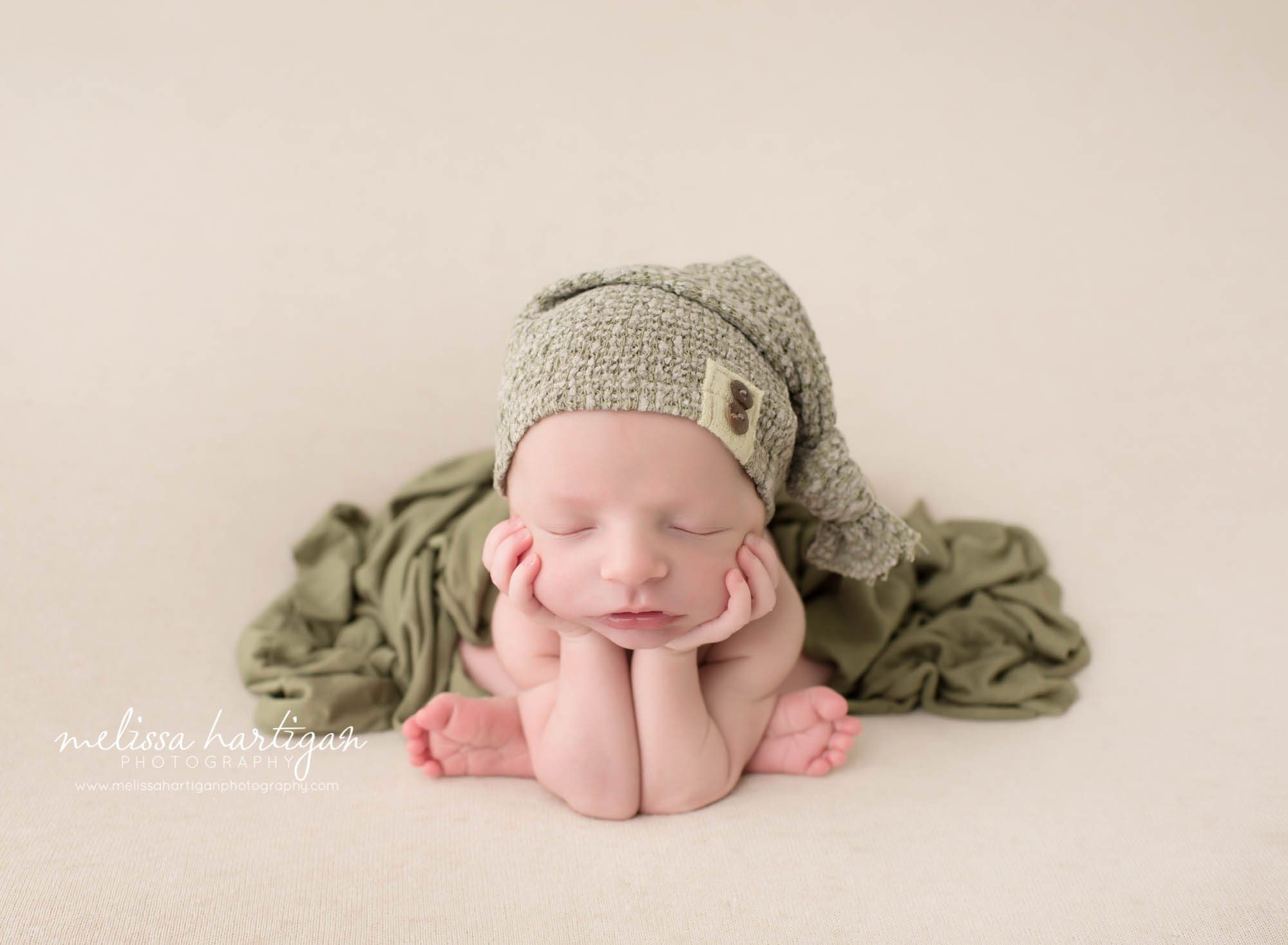 Melissa Hartigan Photography CT Newborn Photographer Stafford baby boy sleeping in froggy pose wearing green knit hat and blanket