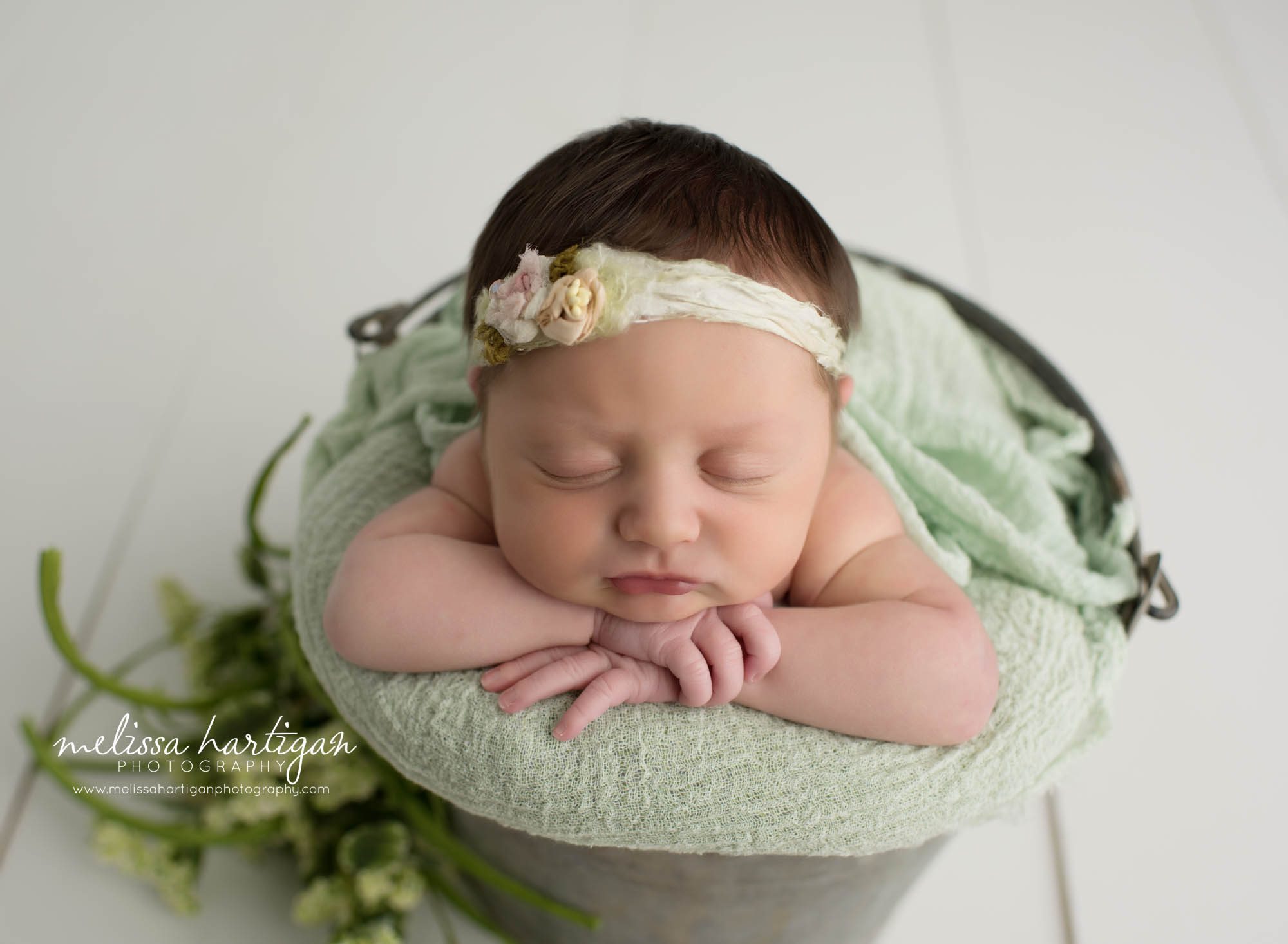 Leila CT Newborn Session baby girl sleeping in metal bucket with green blanket