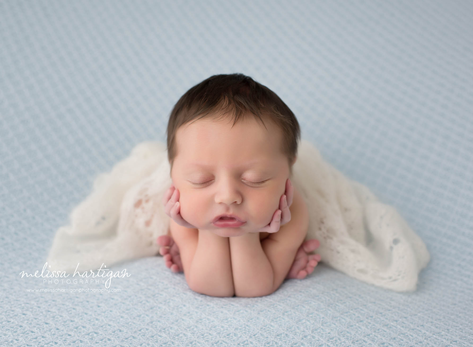 Leila CT Newborn Session baby girl sleeping in froggy pose on blue blanket