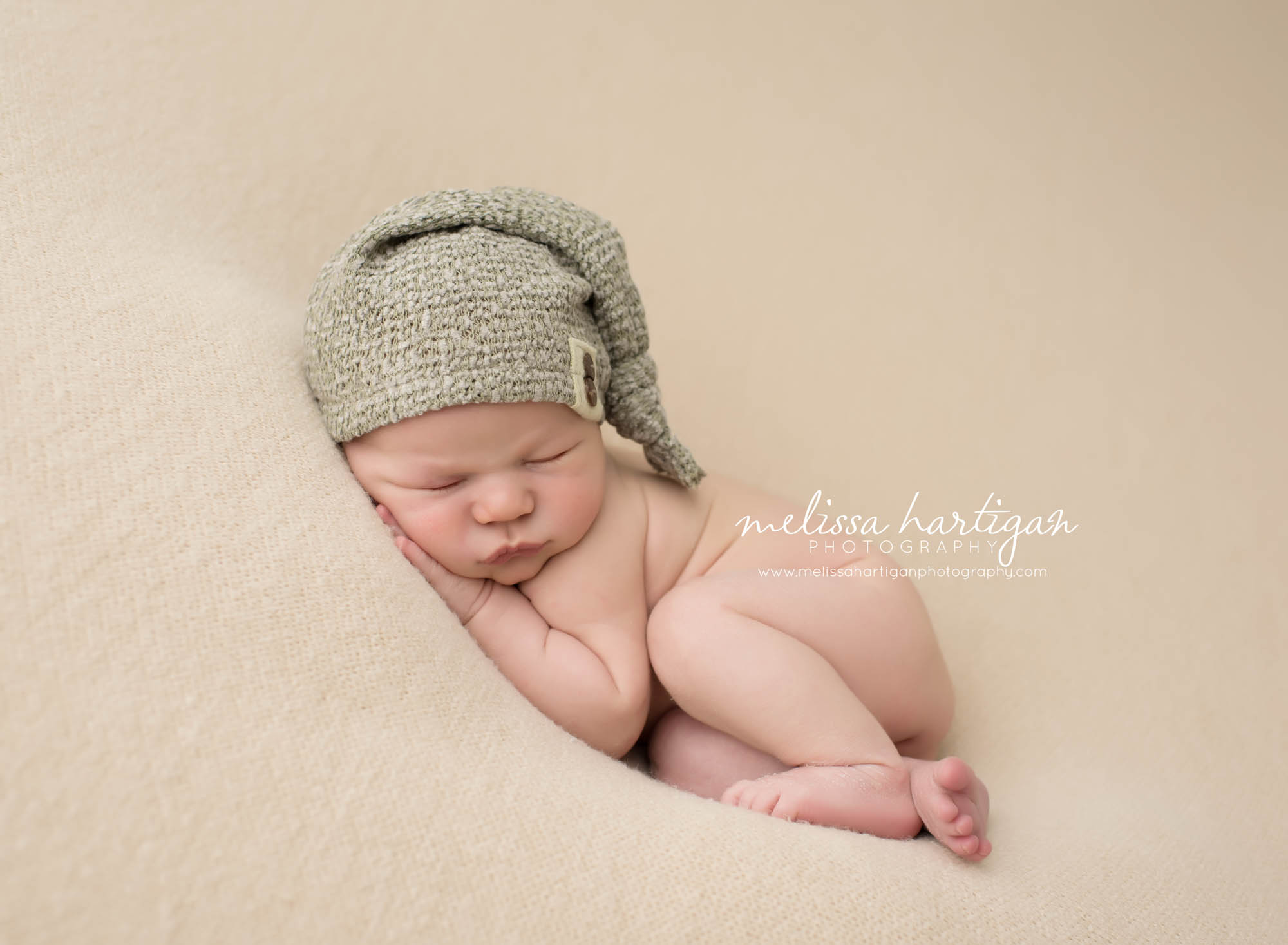 Newborn Session CT baby boy sleeping wearing gray knit hat
