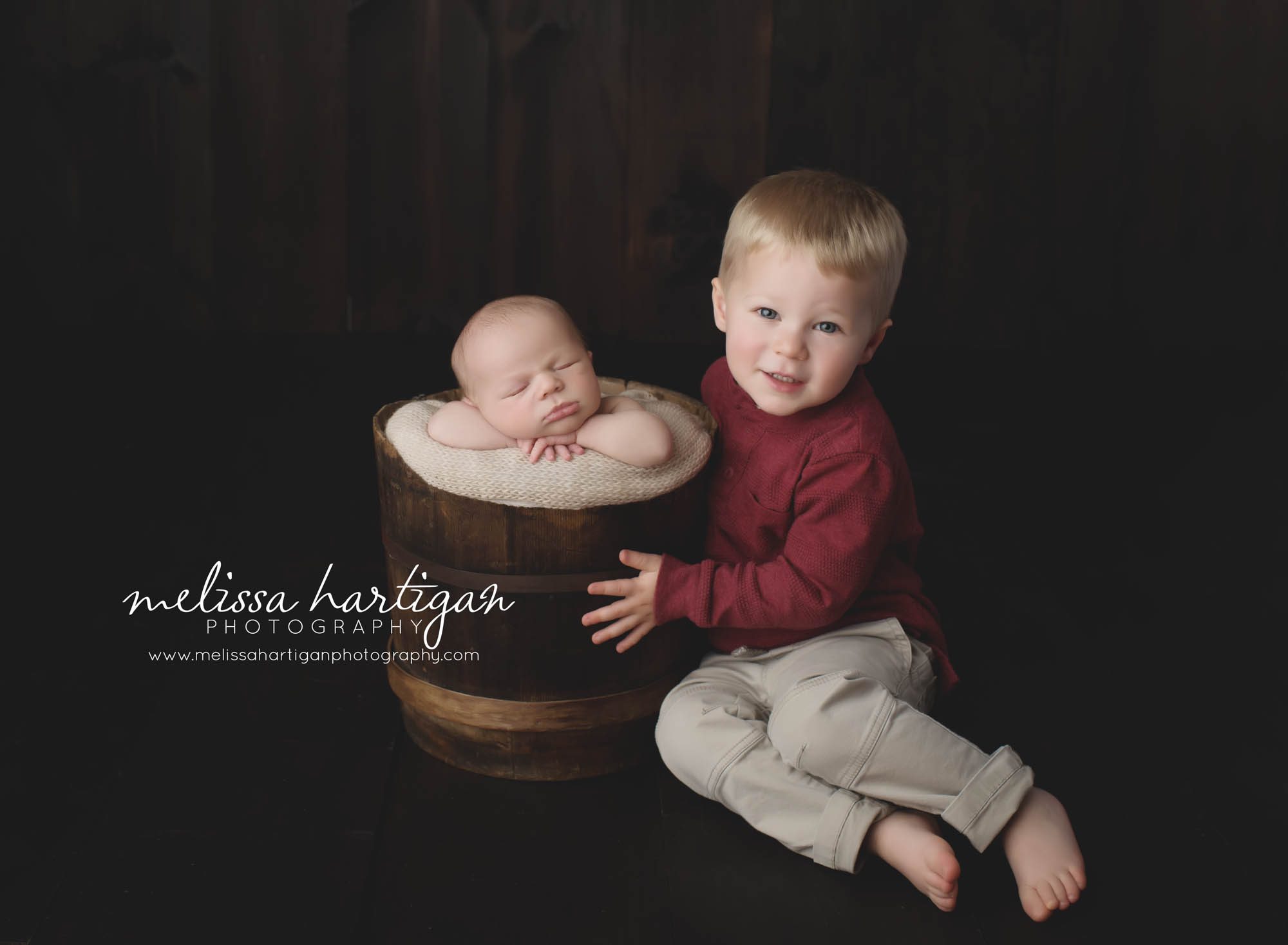 Newborn Session CT baby boy sleeping in wooden bucket posing with brother