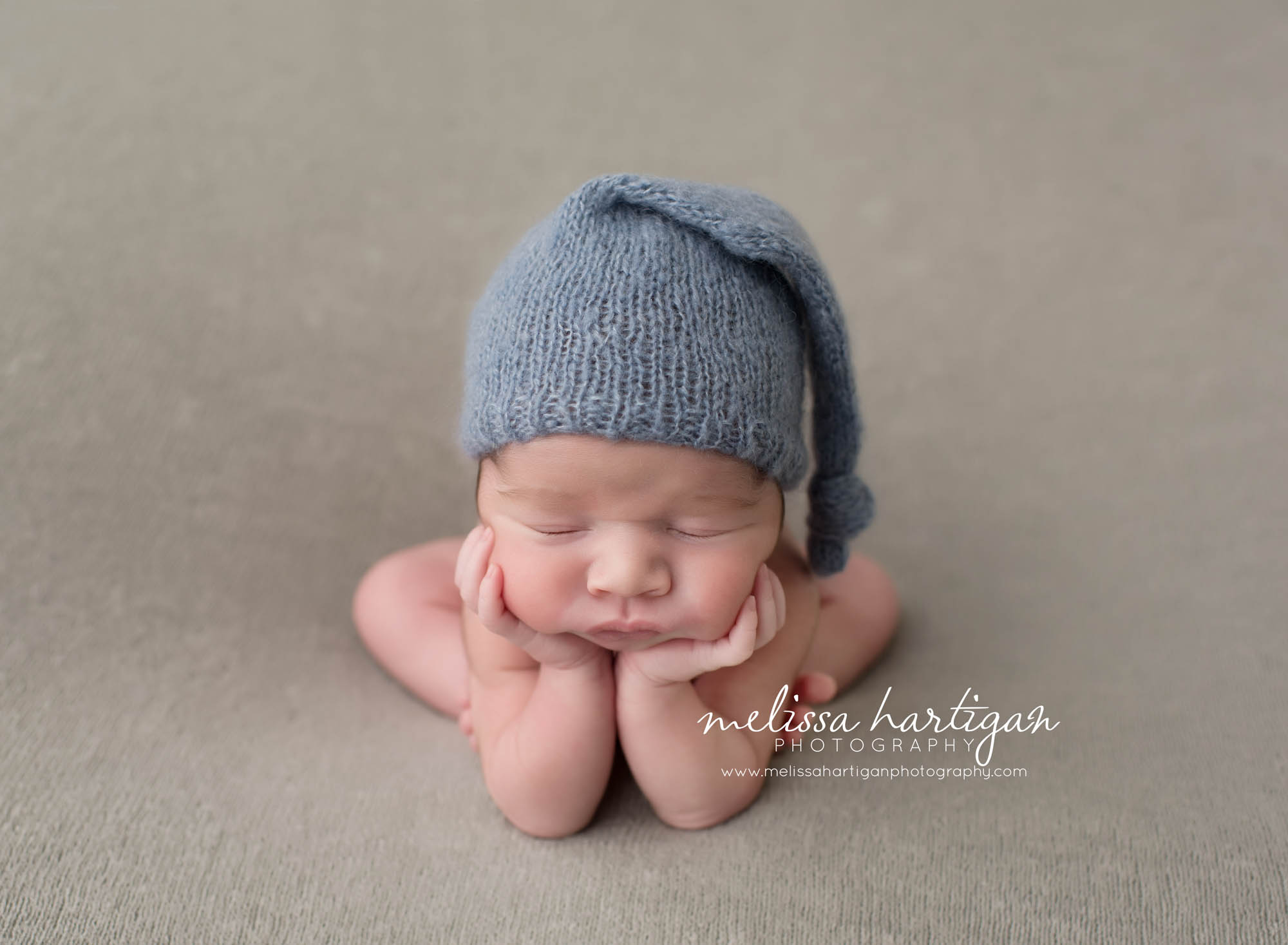 CT Newborn Photographer baby boy sleeping in froggy pose with blue hat