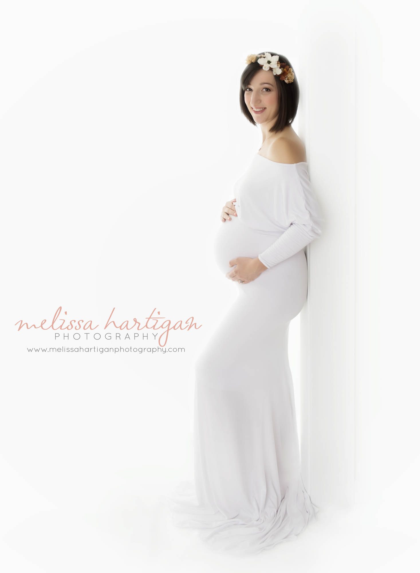 CT Maternity Photographer maternity pose mom wears a long white off the shoulders gown