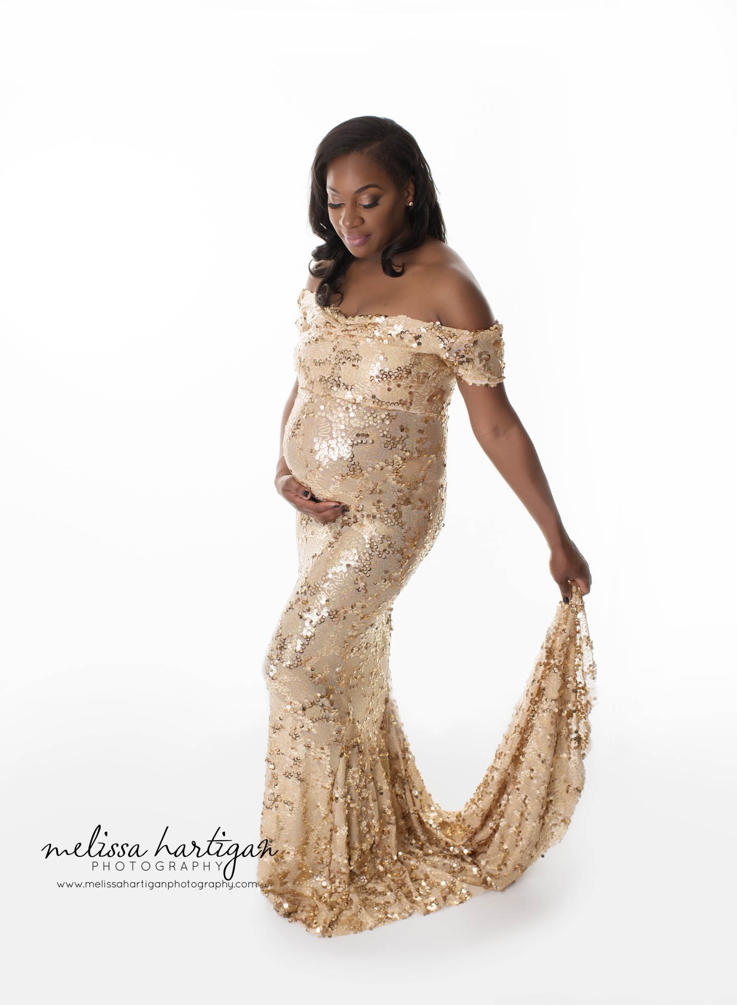 CT Newborn and Maternity Photographer maternity pose mom wearing long gold sequined dress