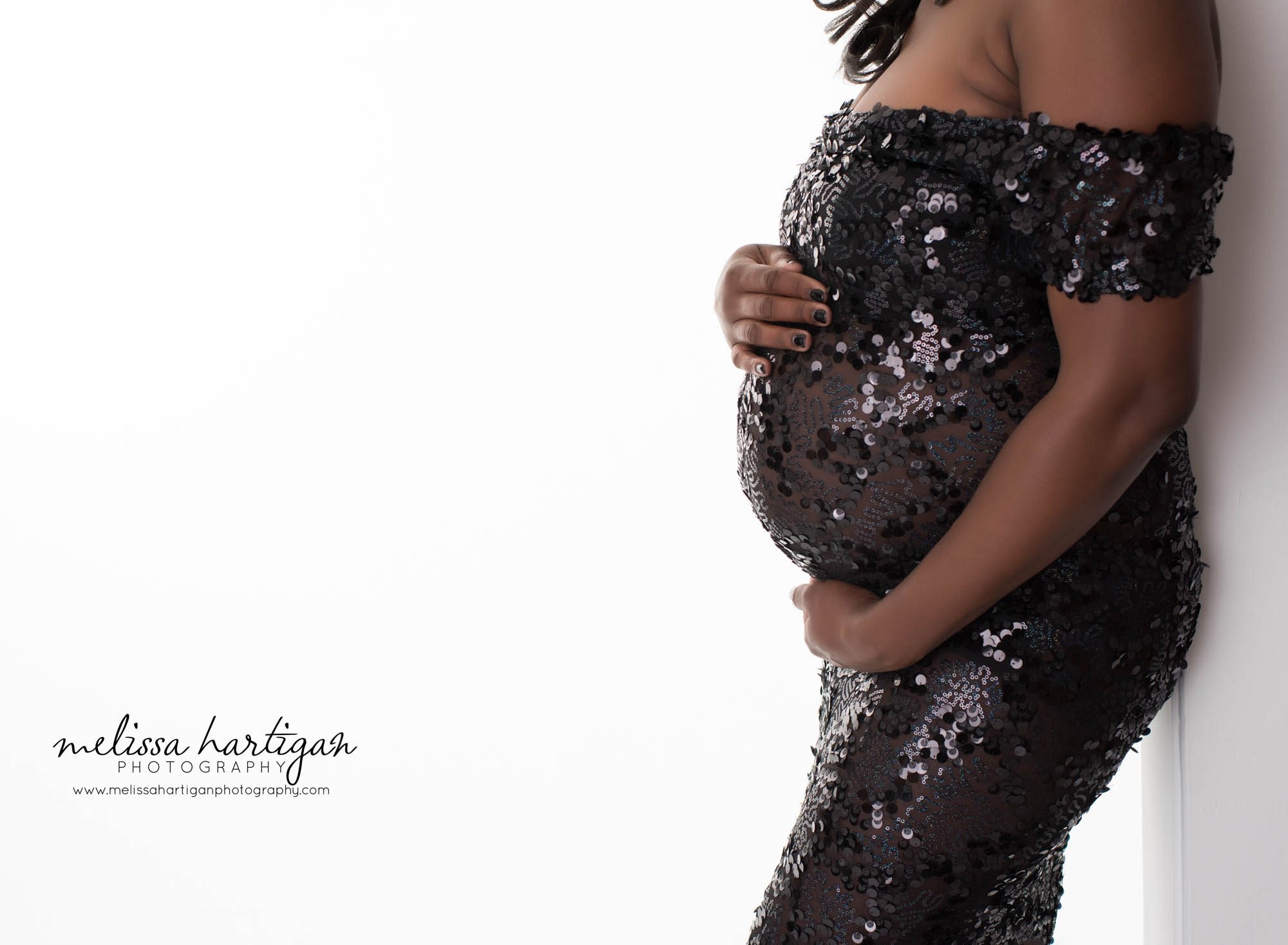 CT Newborn and Maternity Photographer maternity pose wearing long black sequined maternity dress close-up