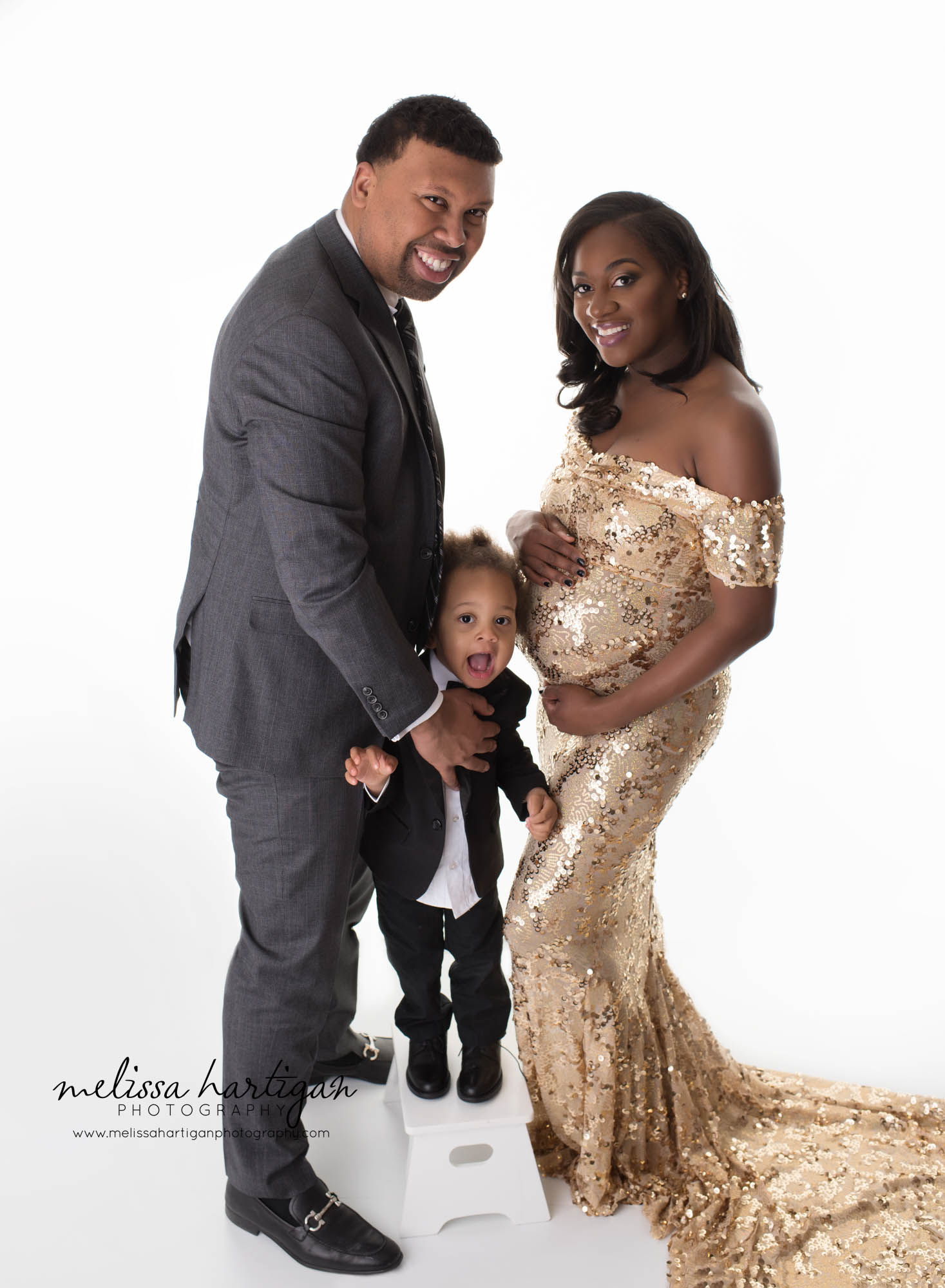 CT Newborn and Maternity Photographer maternity pose with husband and toddler smiling