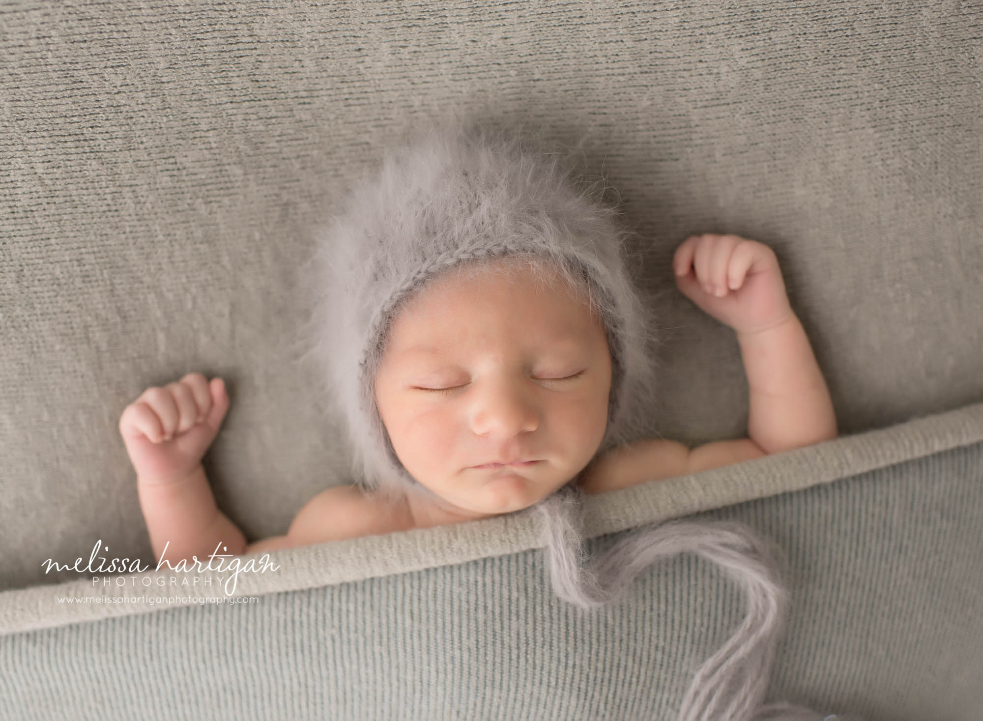 Newborn Photographer Connecticut newborn pose baby sleeping tucked under gray blanket