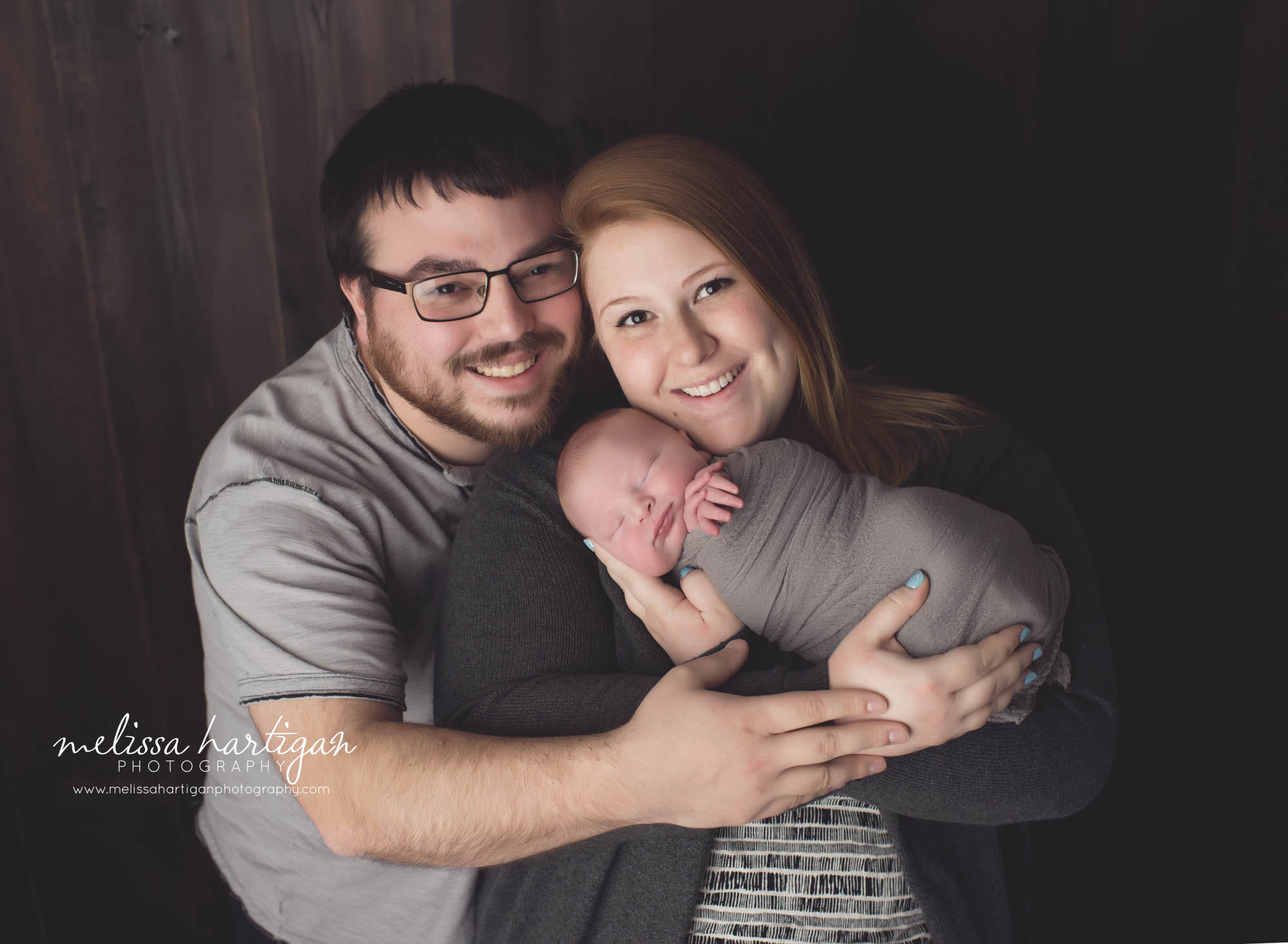 Newborn photographer CT newborn pose baby with parents