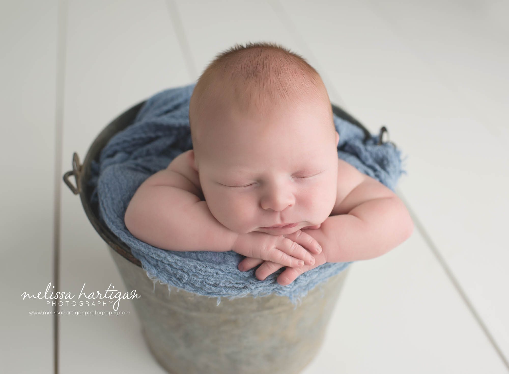 Newborn Photographer CT newborn pose baby in bucket