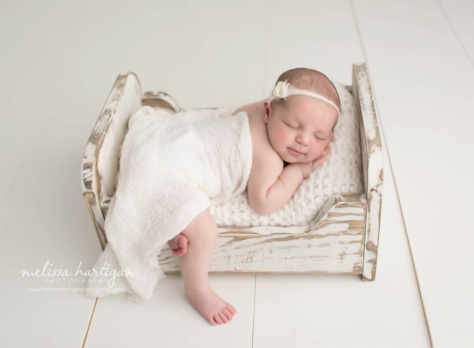 Connecticut Newborn Photographer baby sleeping in bed