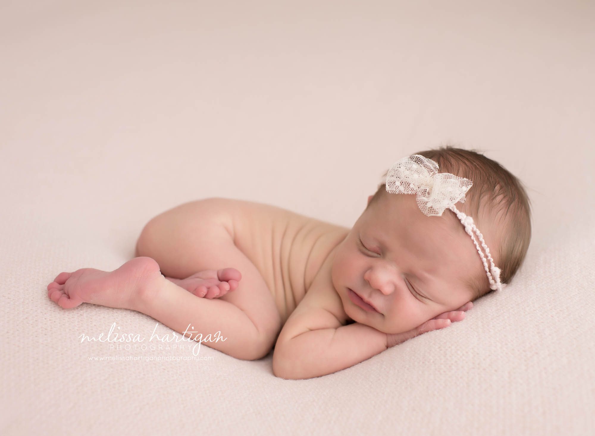CT Baby Photographer newborn sleeping with bow headband