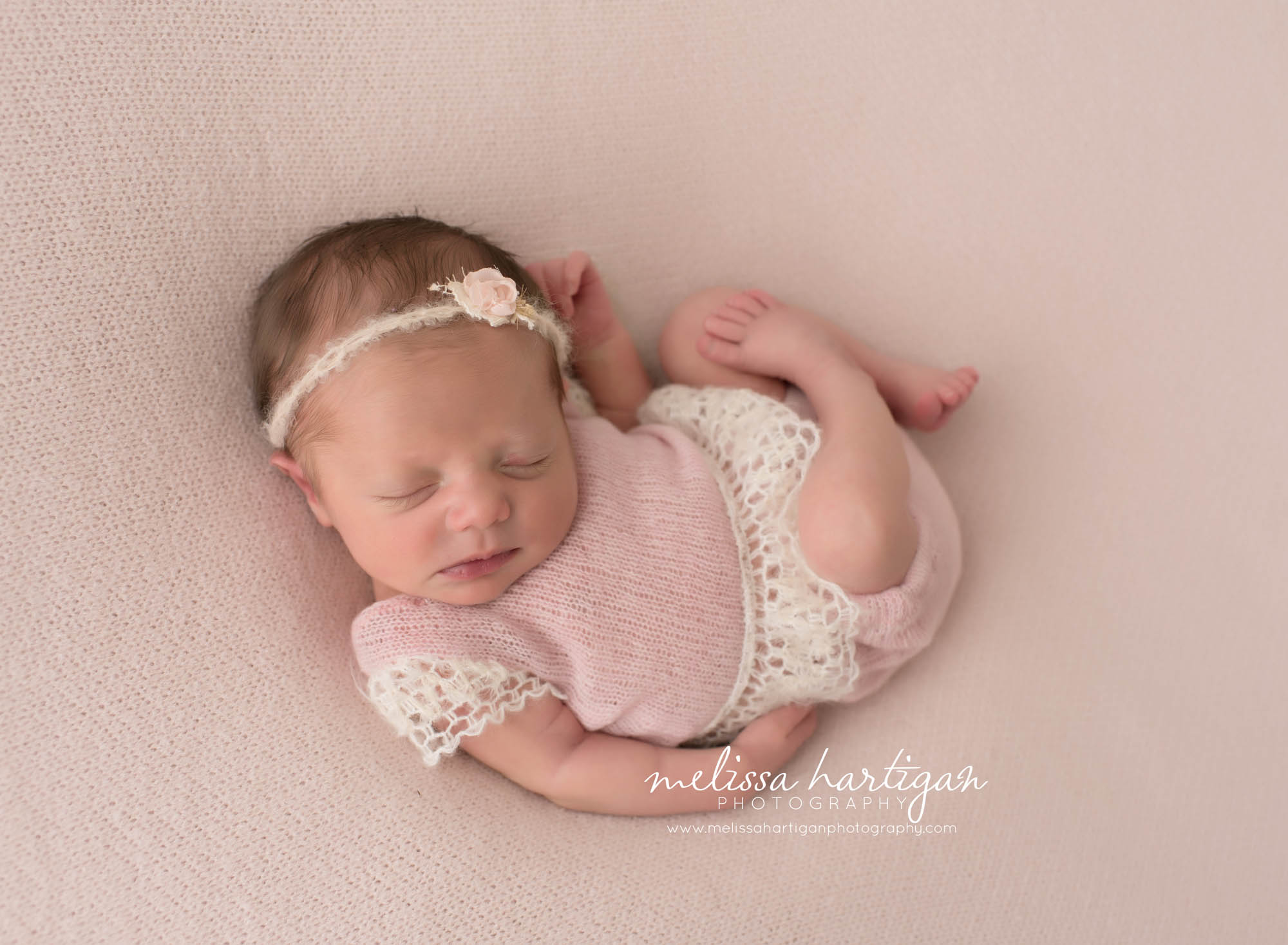 CT Baby Photographer newborn sleeping in pink and lace onesie and headband