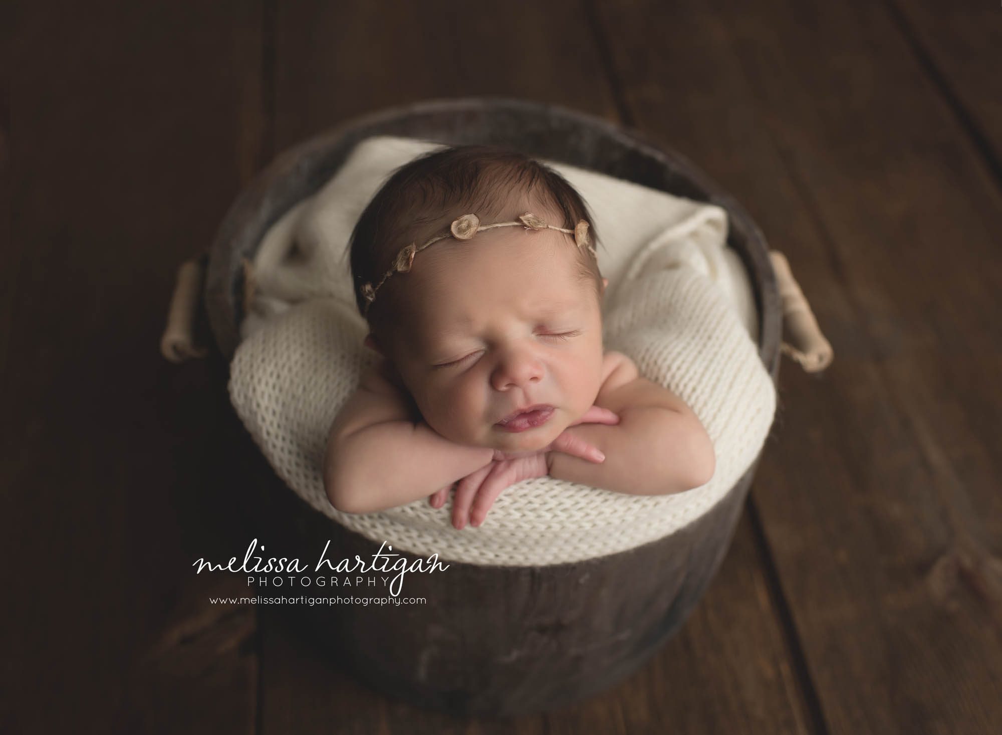 CT Baby Photographer baby sleeping in bucket with floral headband