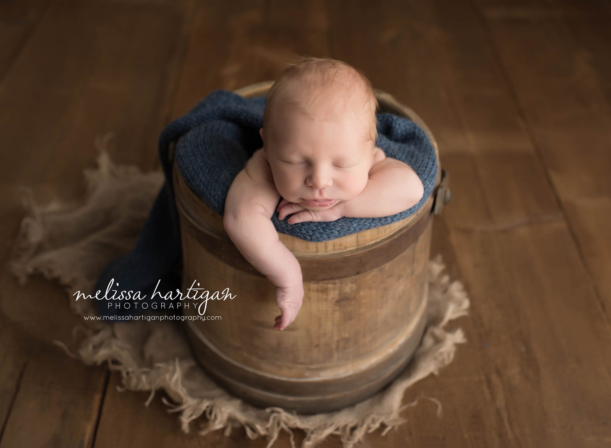 CT Baby Photography newborn boy sleeping in wooden bucket with blue blanket