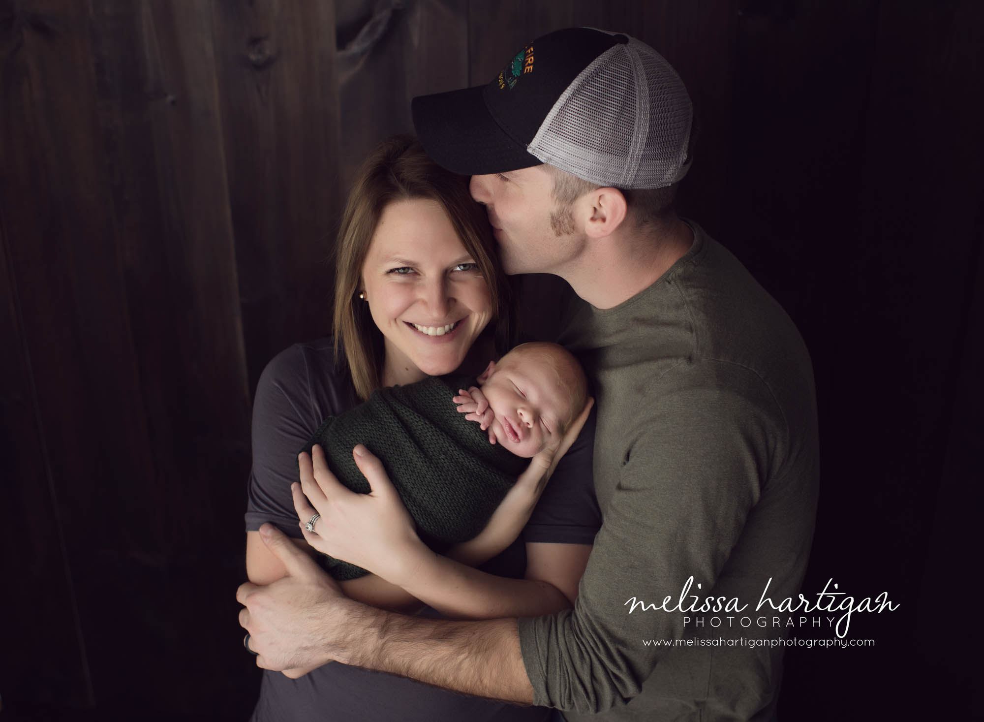 CT Baby Photography newborn boy with family pose father kissing mom's head