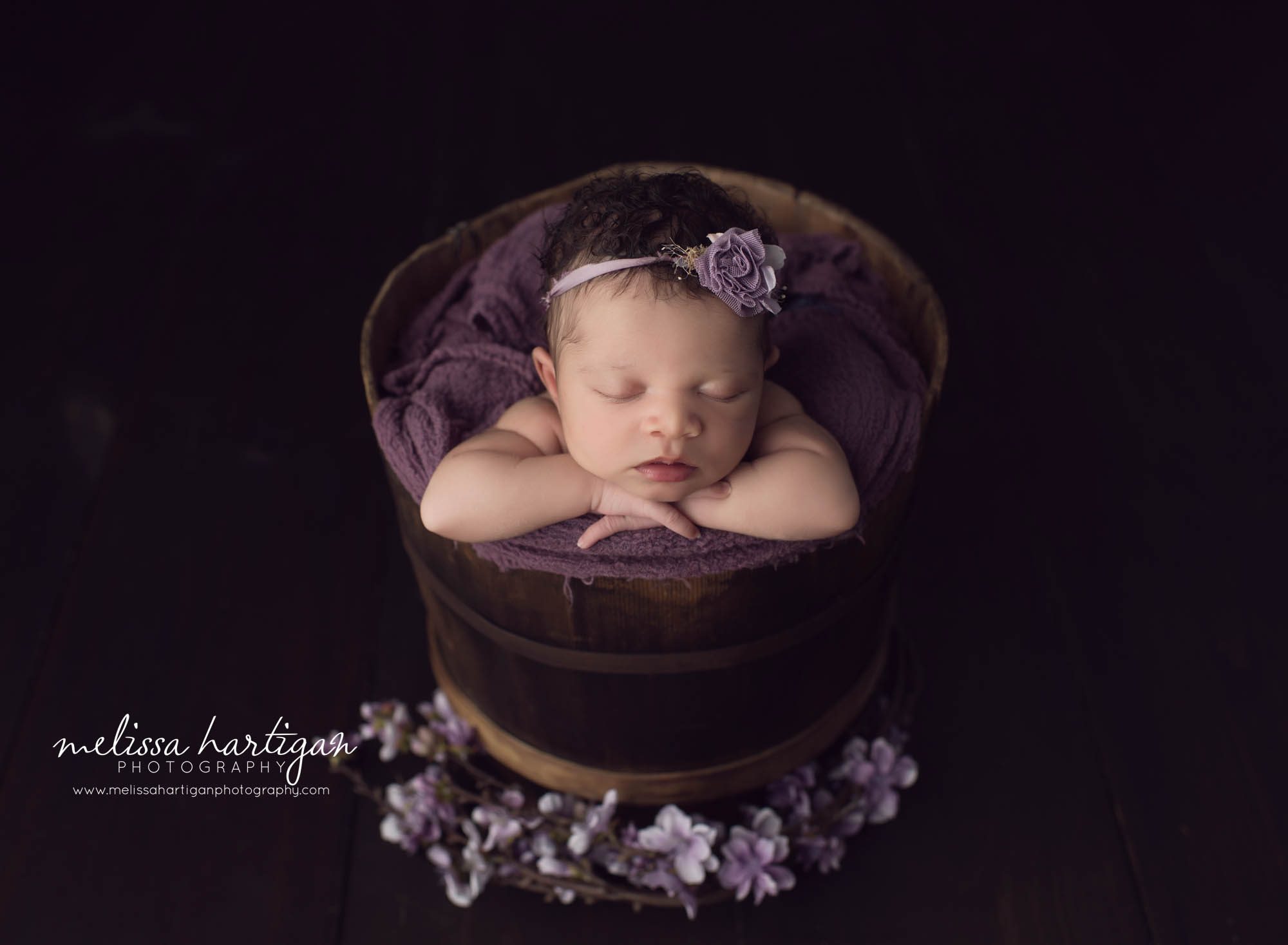 baby girl posed in bucket with her hands crossed newborn photos connecticut newborn photographer Melissa Hartigan Photography