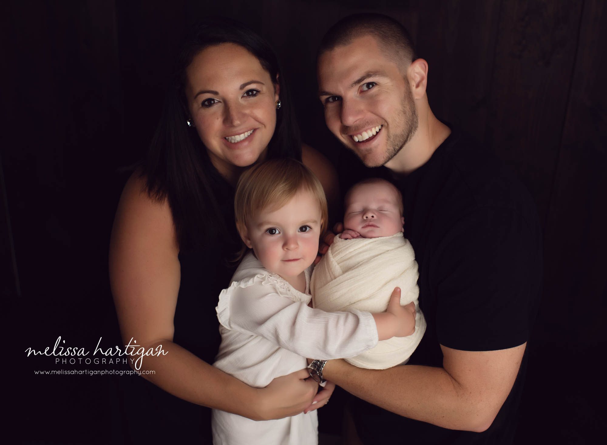 newborn session with family photos m om dad older sibling sister