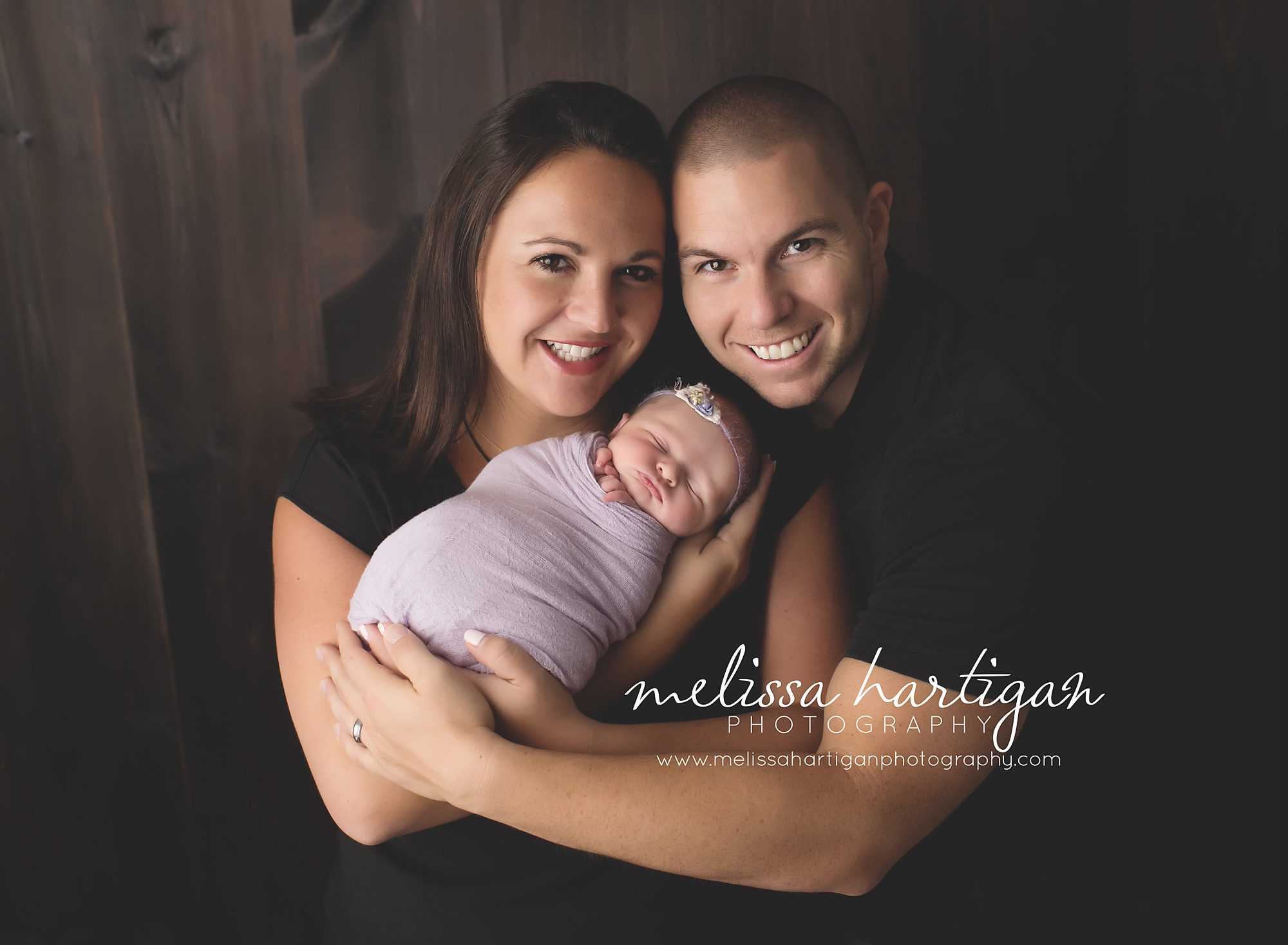 Family photo with baby girl wrapped newborn photographer CT