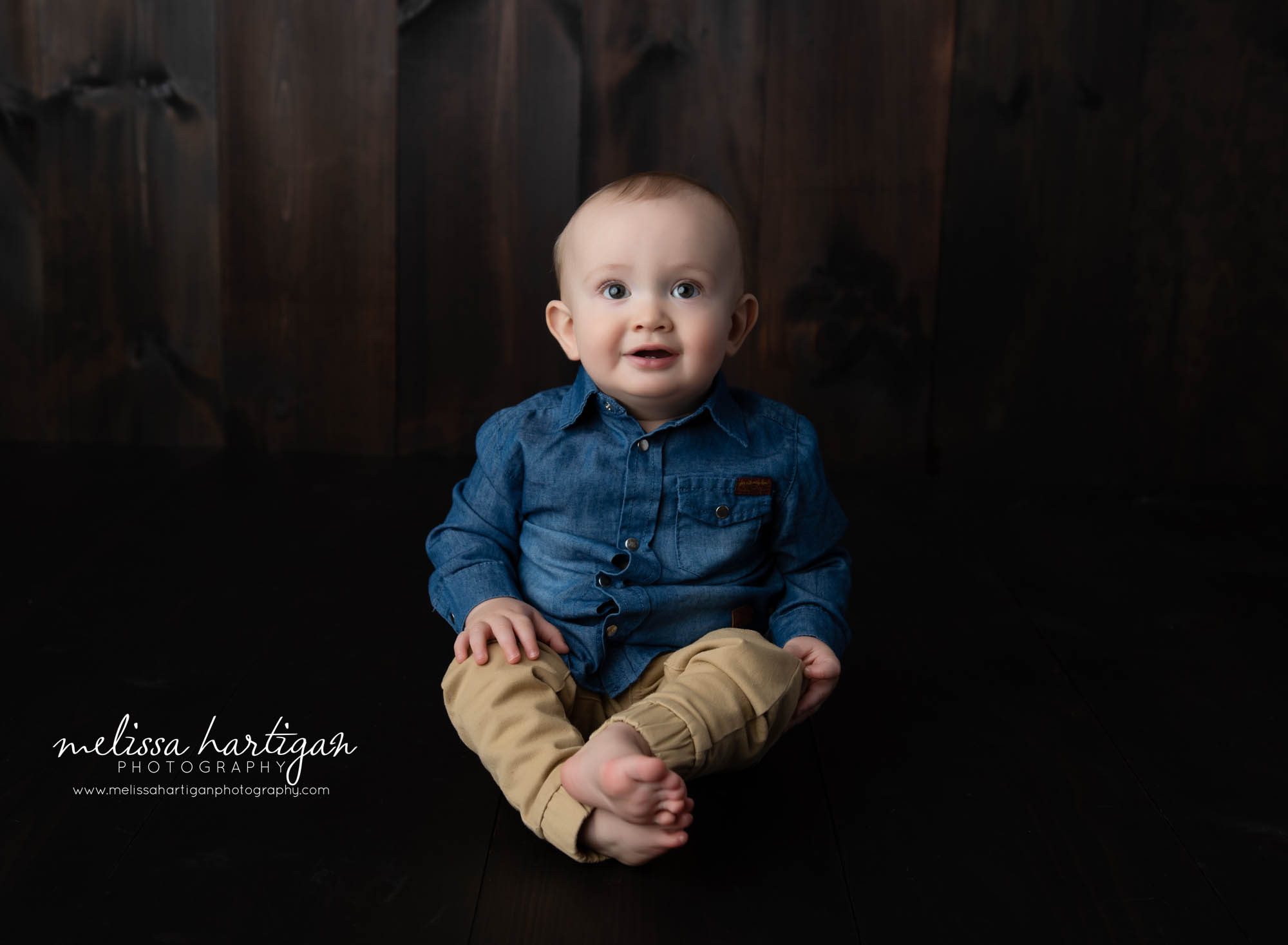 baby boy sitting on wood boards in studio sitting up photo session CT baby milestone photographer