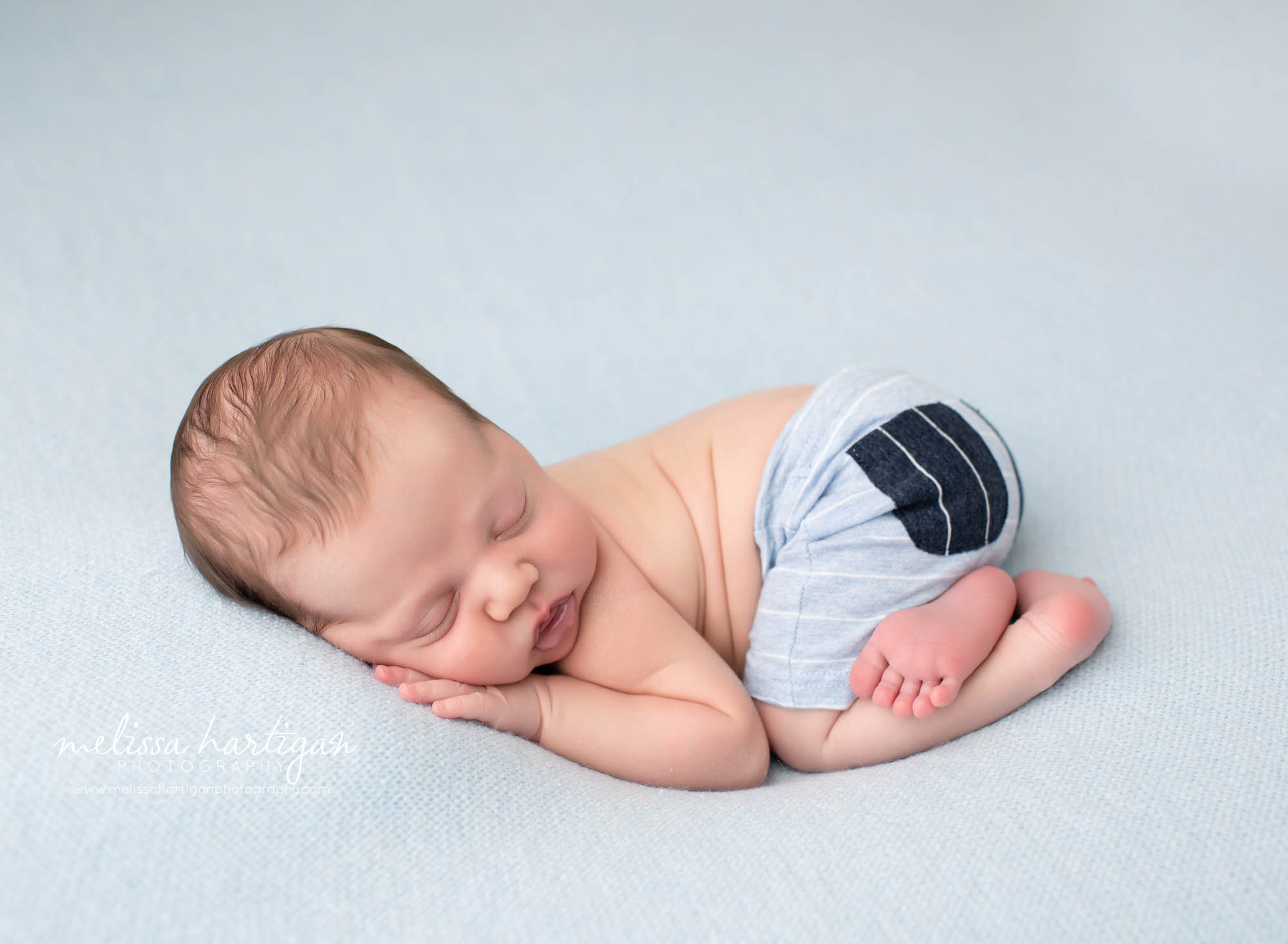 baby boy posed tushie up bum up pose on light blue backdrop Eastern CT Newborn photography