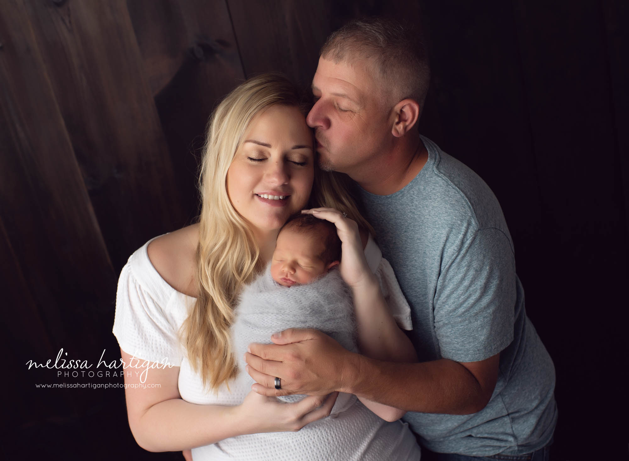 Mom dad and newborn baby boy studio family photography pose CT newborn photos