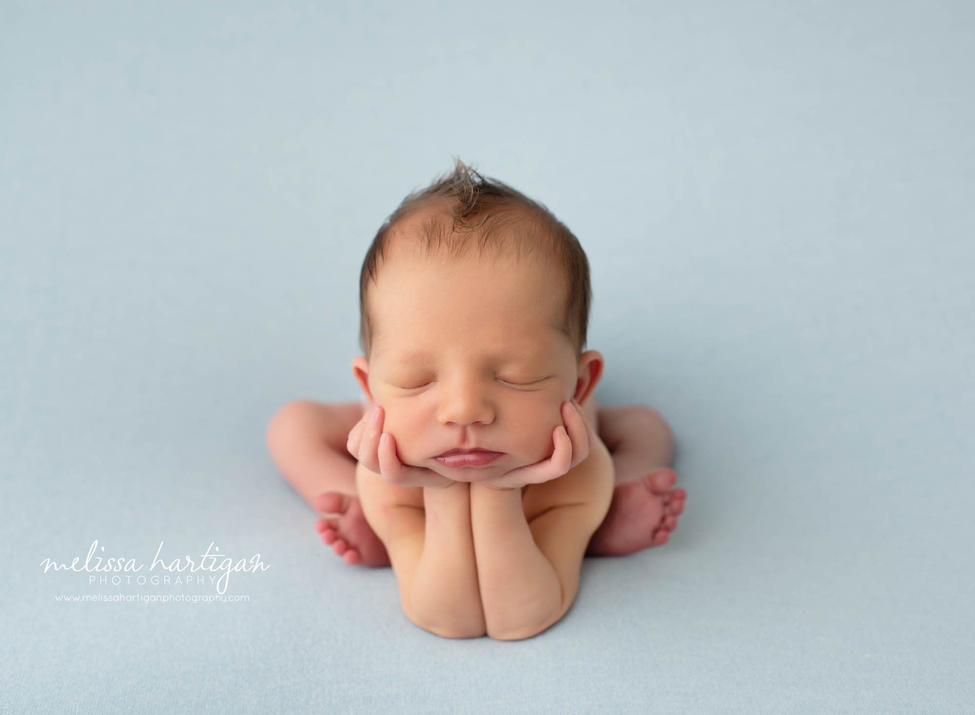 Baby boy posed in froggy pose newborn photography CT