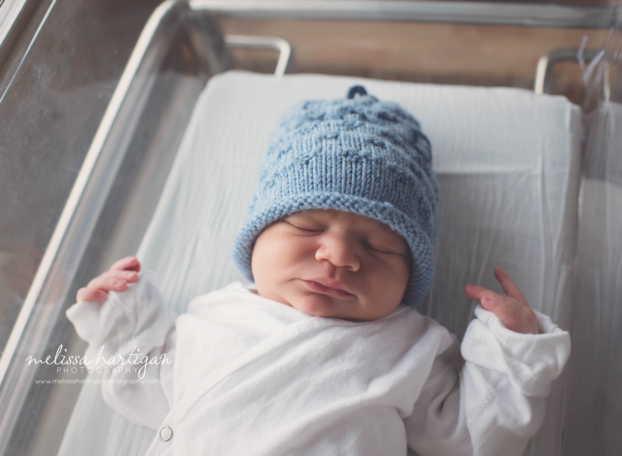 newborn baby in hospital basinet