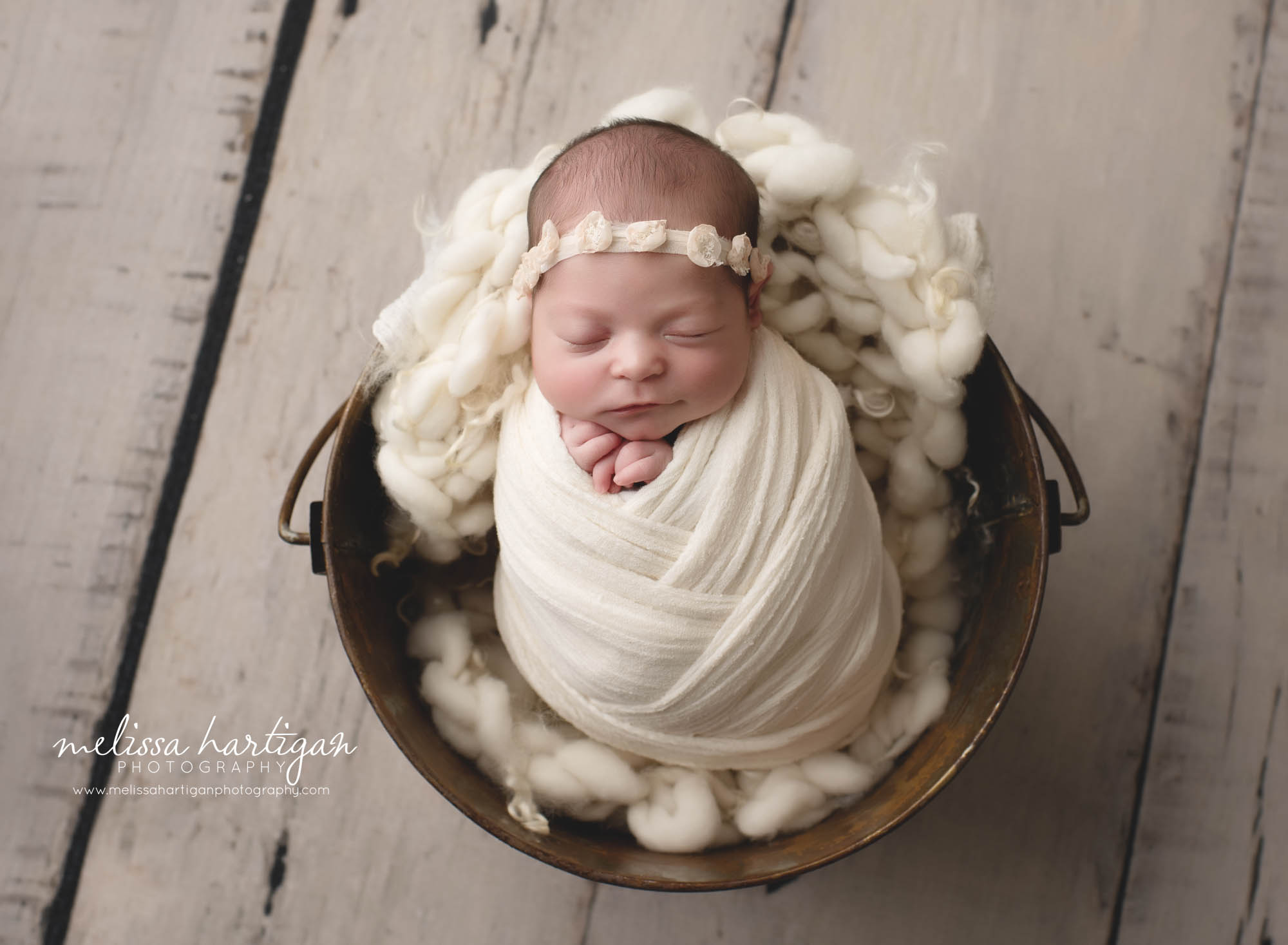 Baby girl wrappe din white wrap with flower headband CT newborn Photographer