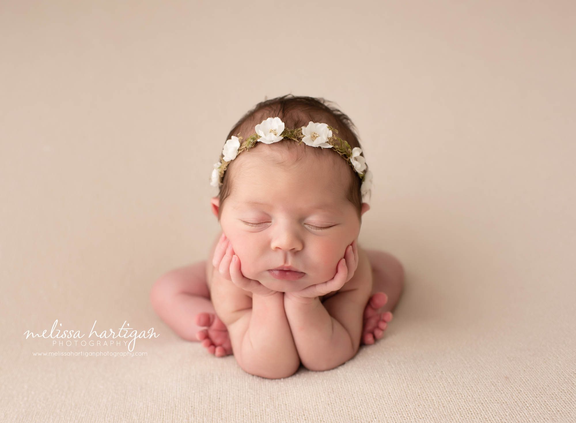 baby girl posed groggie pose with flower wreath headband