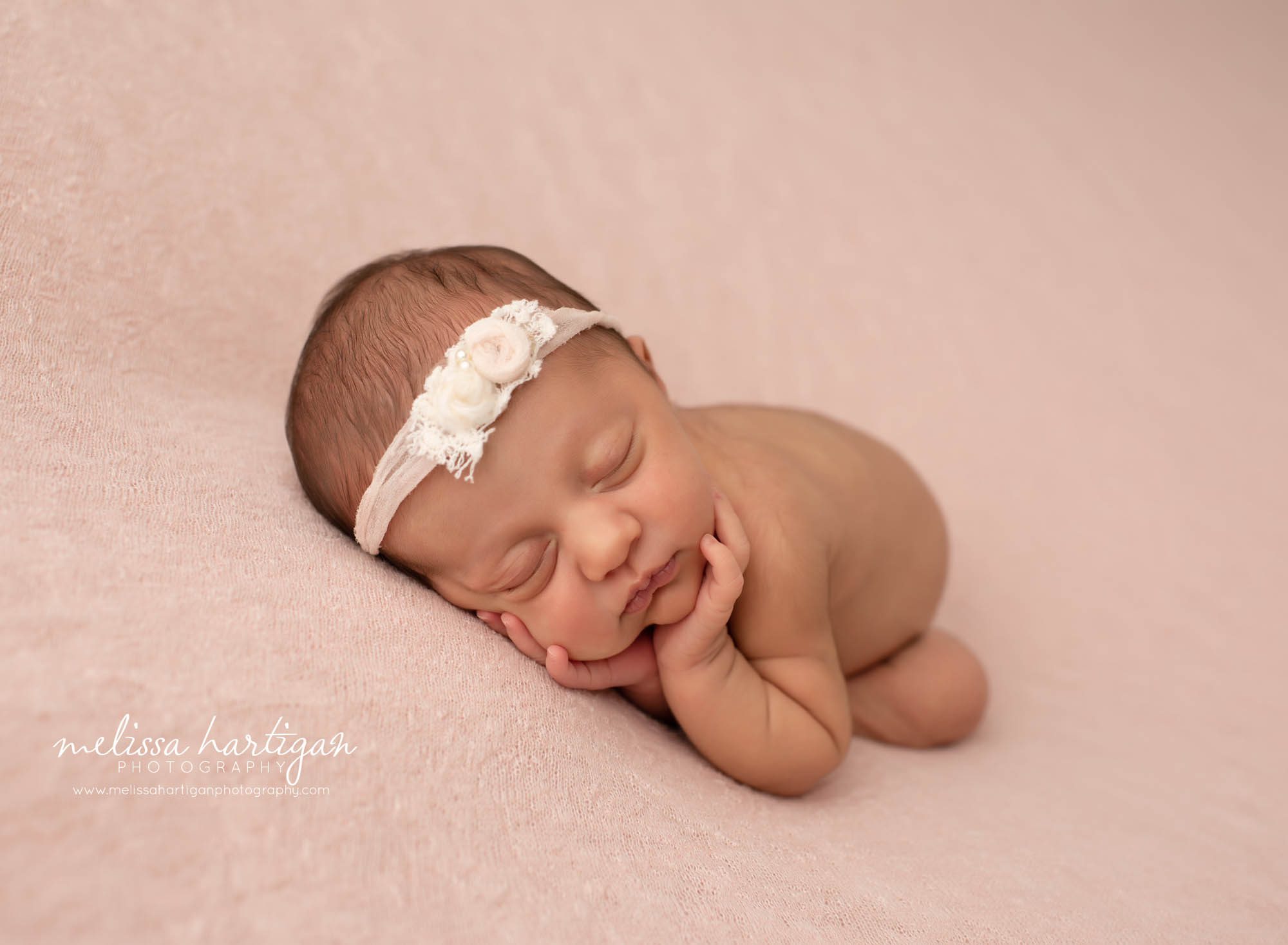 baby girl timber pose with pretty flower headband
