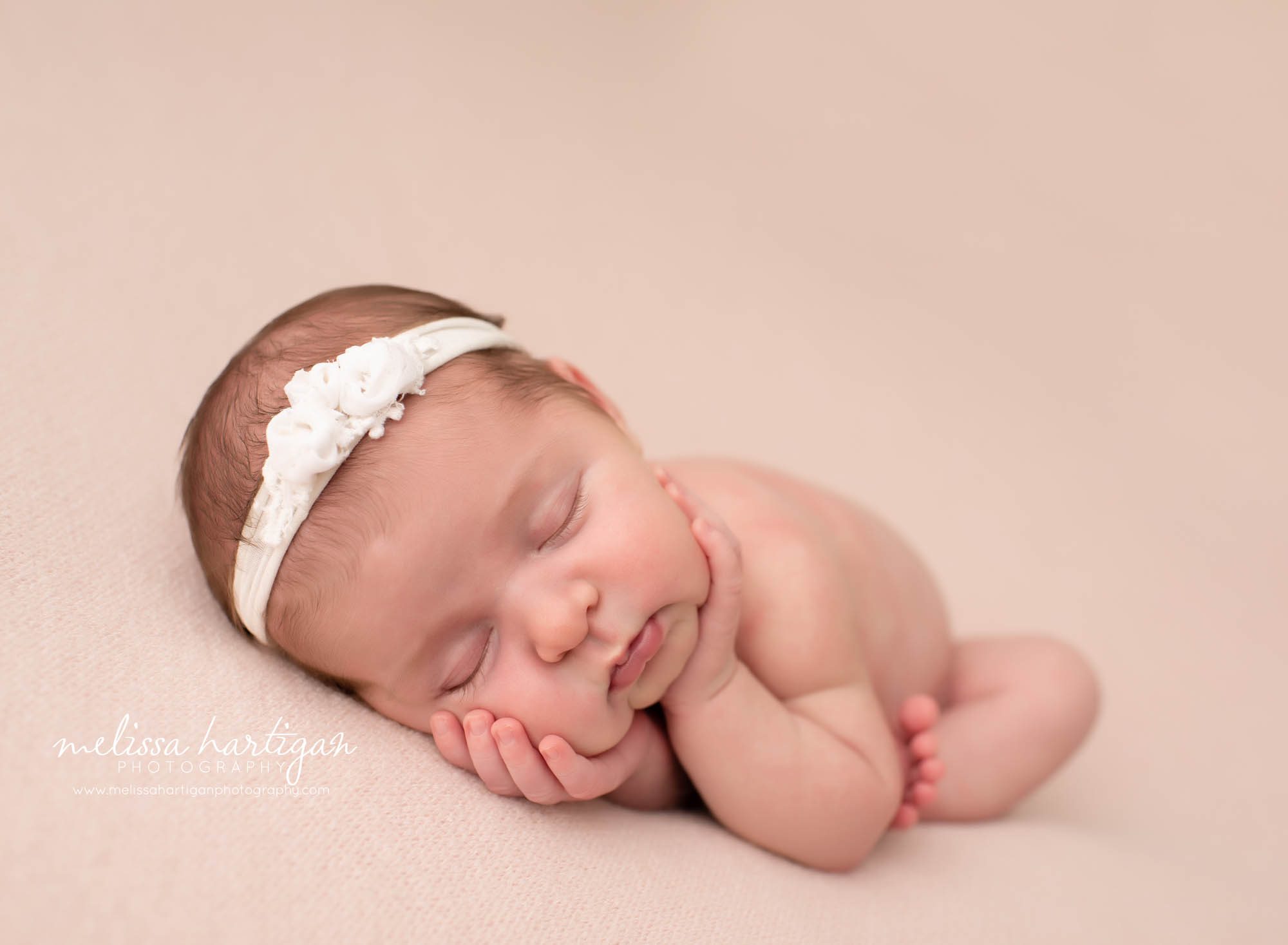 baby girl posed timber pose on pink backdrop with white floral headband CT Baby photography