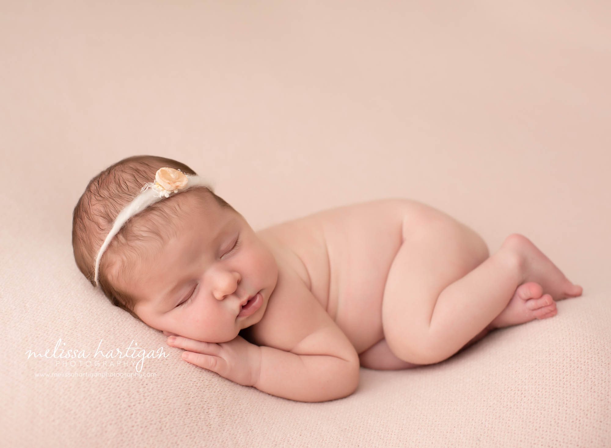 Baby girl posed on side on pink backround CT newborn Photography