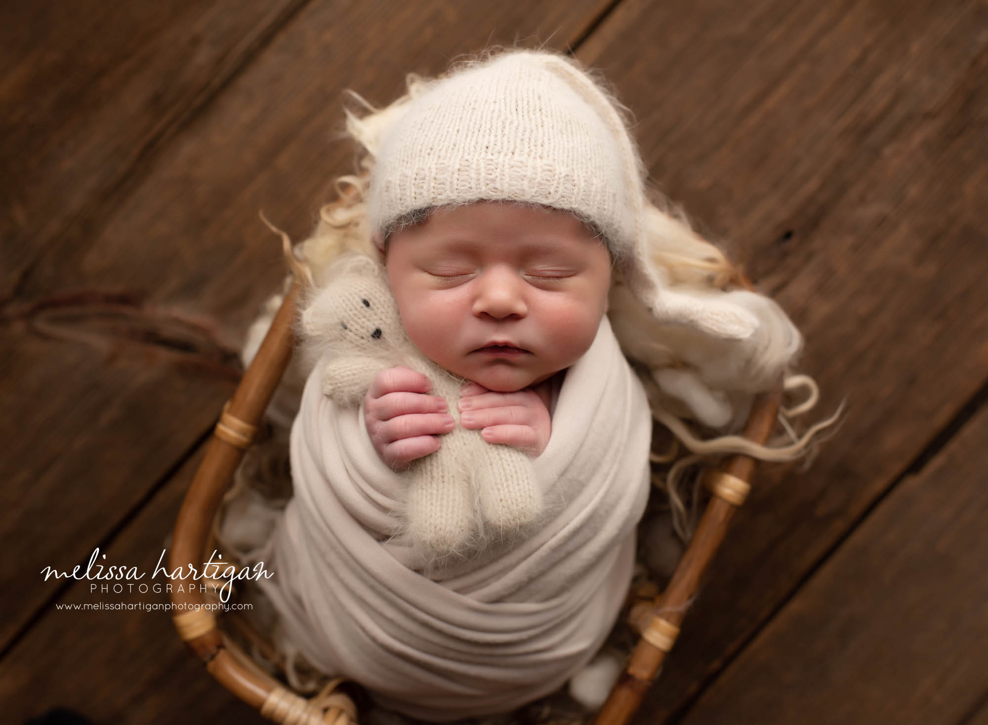 baby boy wrapped in cream wrap with knitted cream sleepy cap and cream teddy bear CT newborn photography session