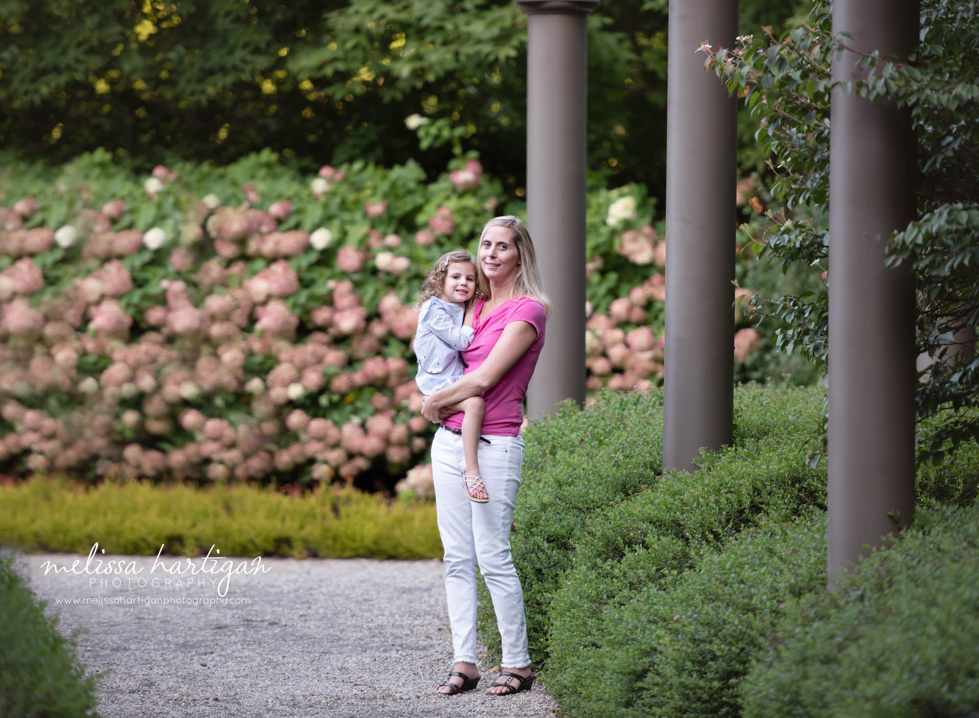 Mom holding daughter standing pose in Wickham Park Manchester CT Family Photographer
