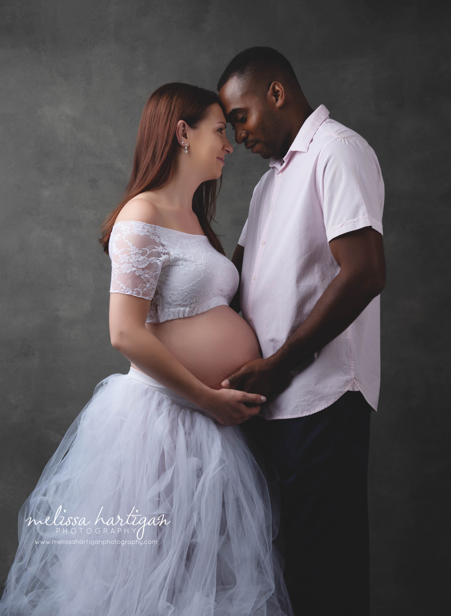 expectant mom and dad studio photography maternity session