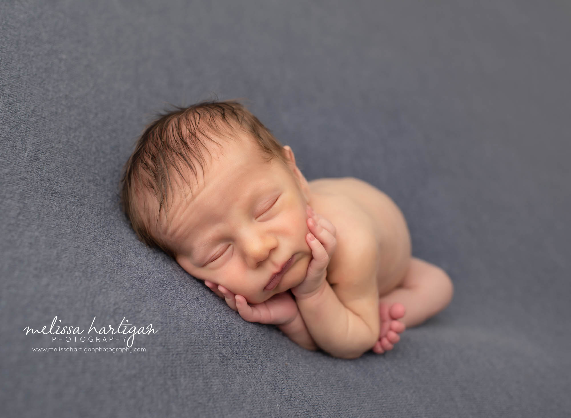 newborn baby boy posed on side posed newborn photography Connecticut photographer
