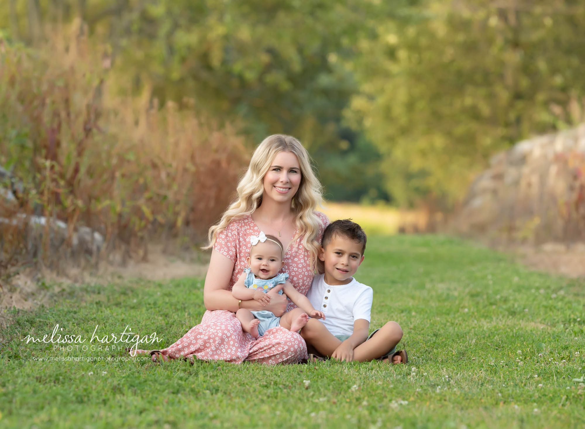 mom and two kids sitting family pose extended family photography session