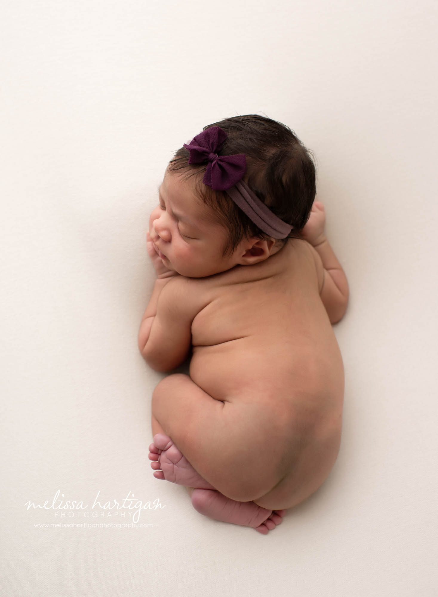 Baby girl posed on tummy CT newborn Photography